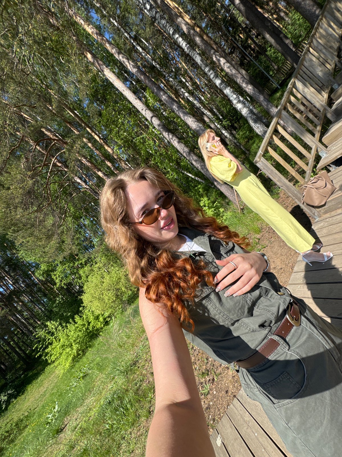 Women photograph themselves at playground in Chaikovsky, Russia