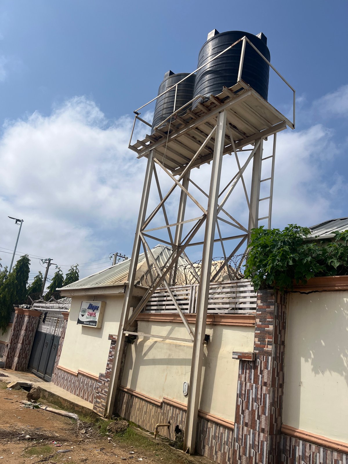 Morning activity around a water tank site in Gura Top, Nigeria