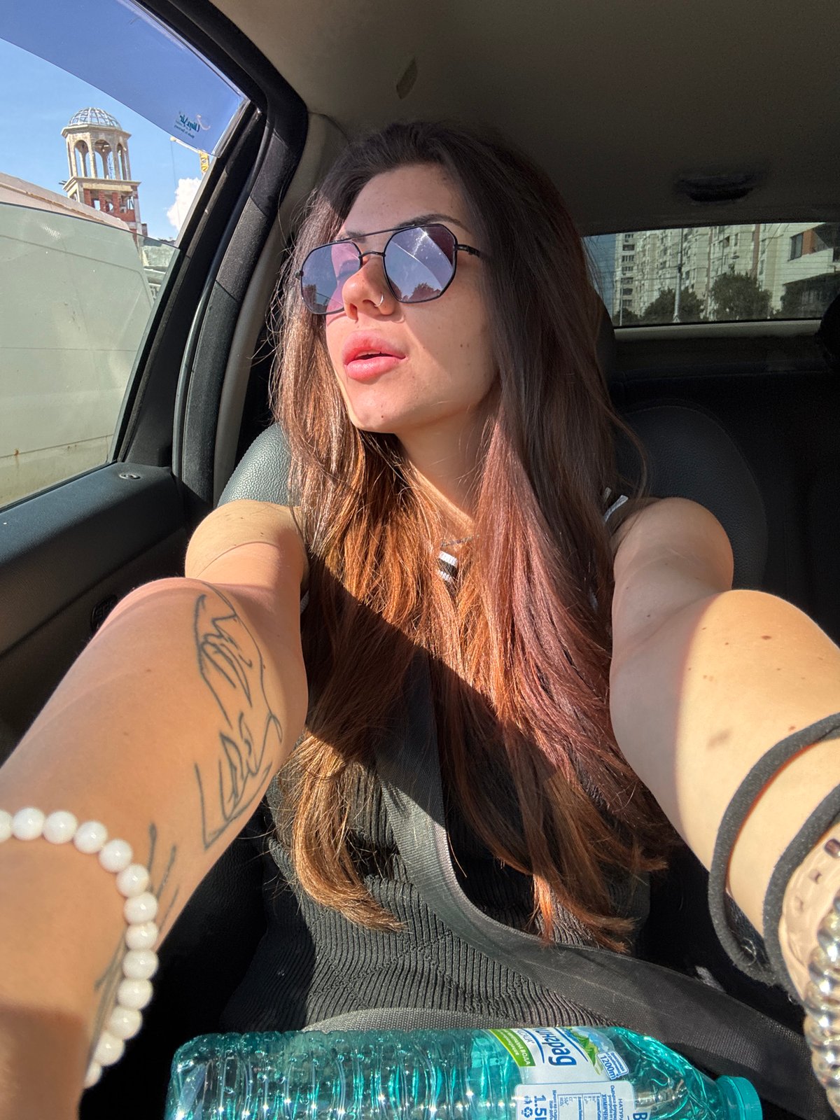 Woman takes car selfies during Sofia traffic
