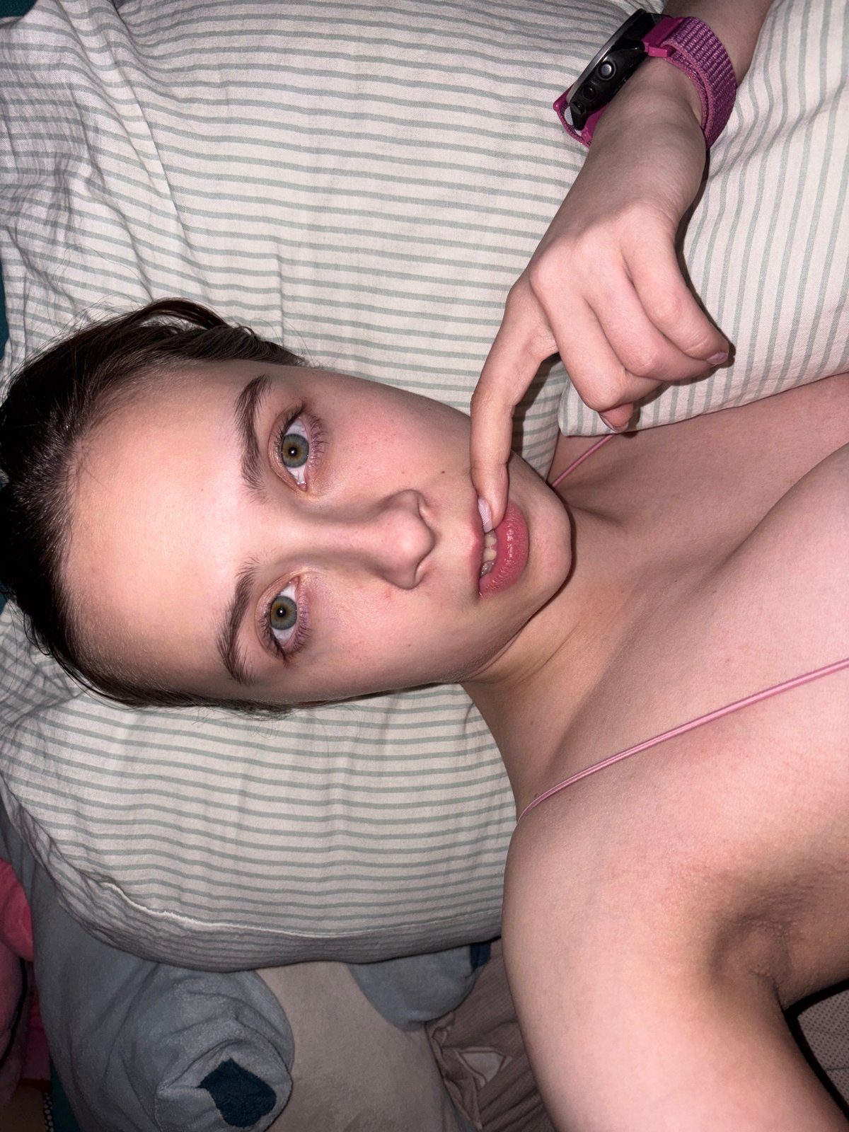 Young woman photographs herself in bedroom, Прикамский Russia