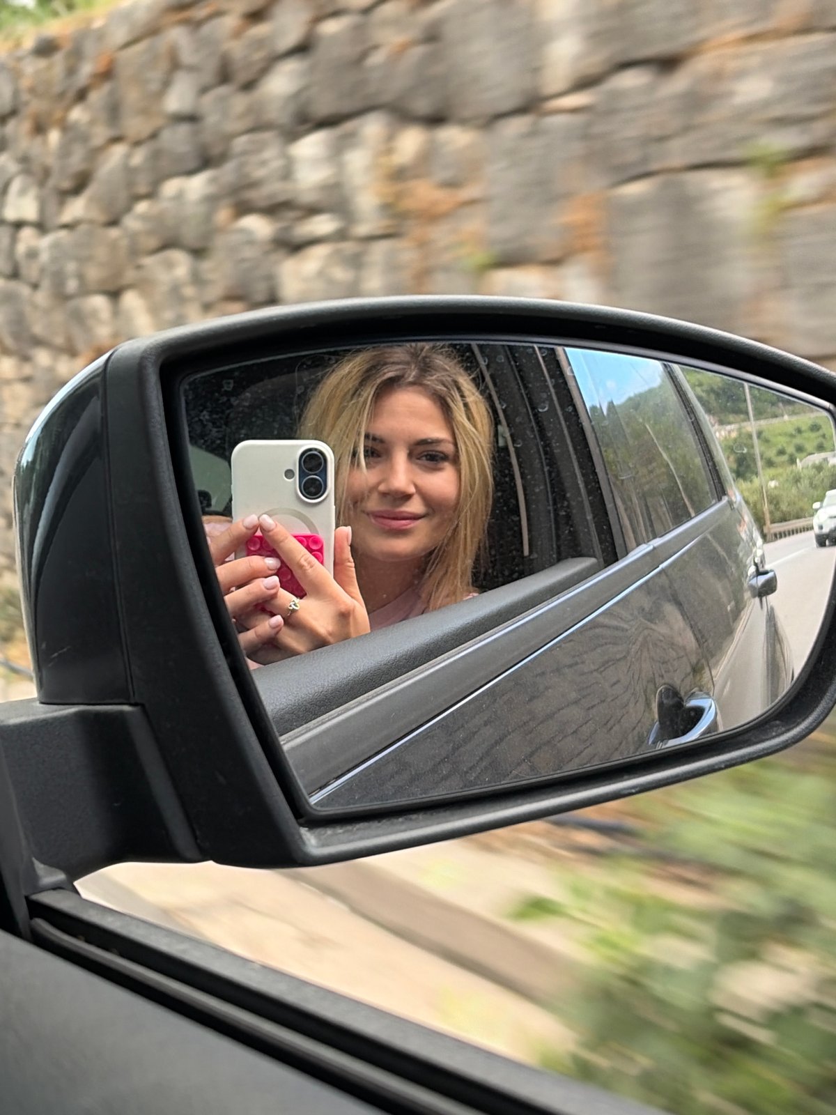 Woman enjoys scenic car ride between Boreti and Budva