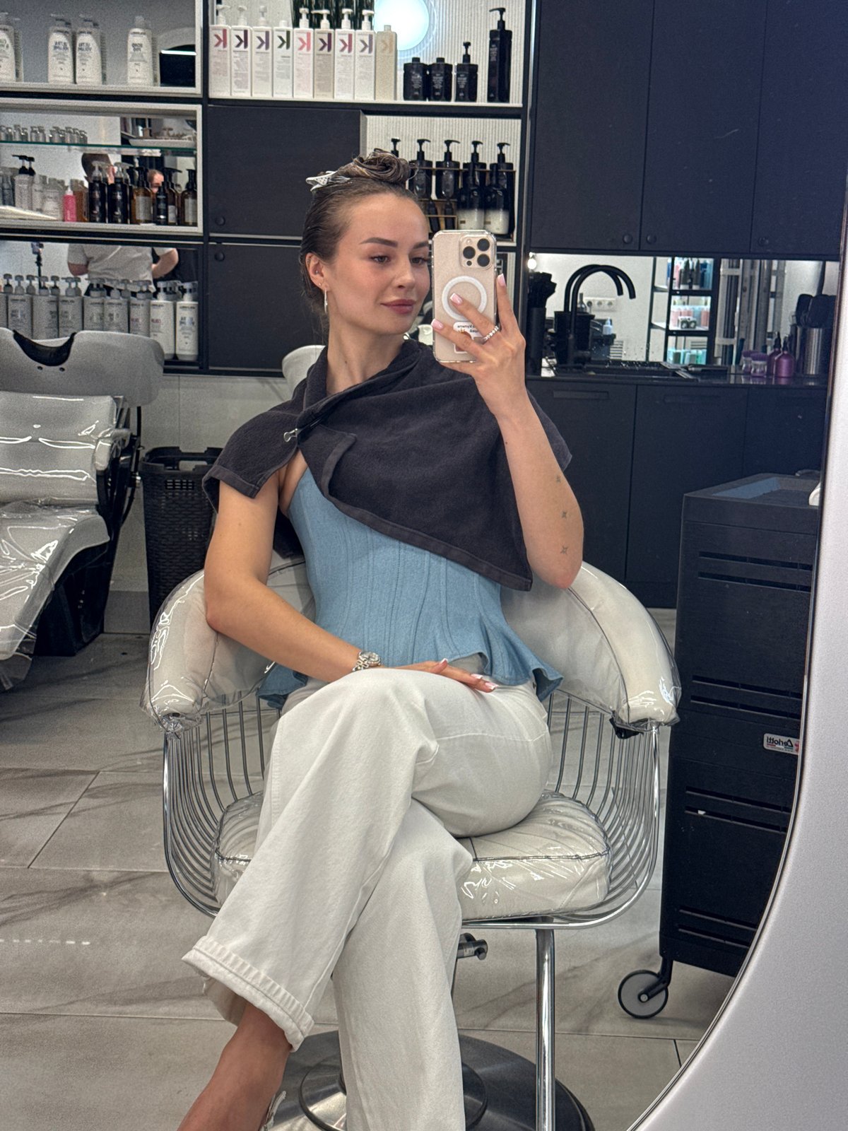 Woman takes salon selfie during hair appointment in Kyiv