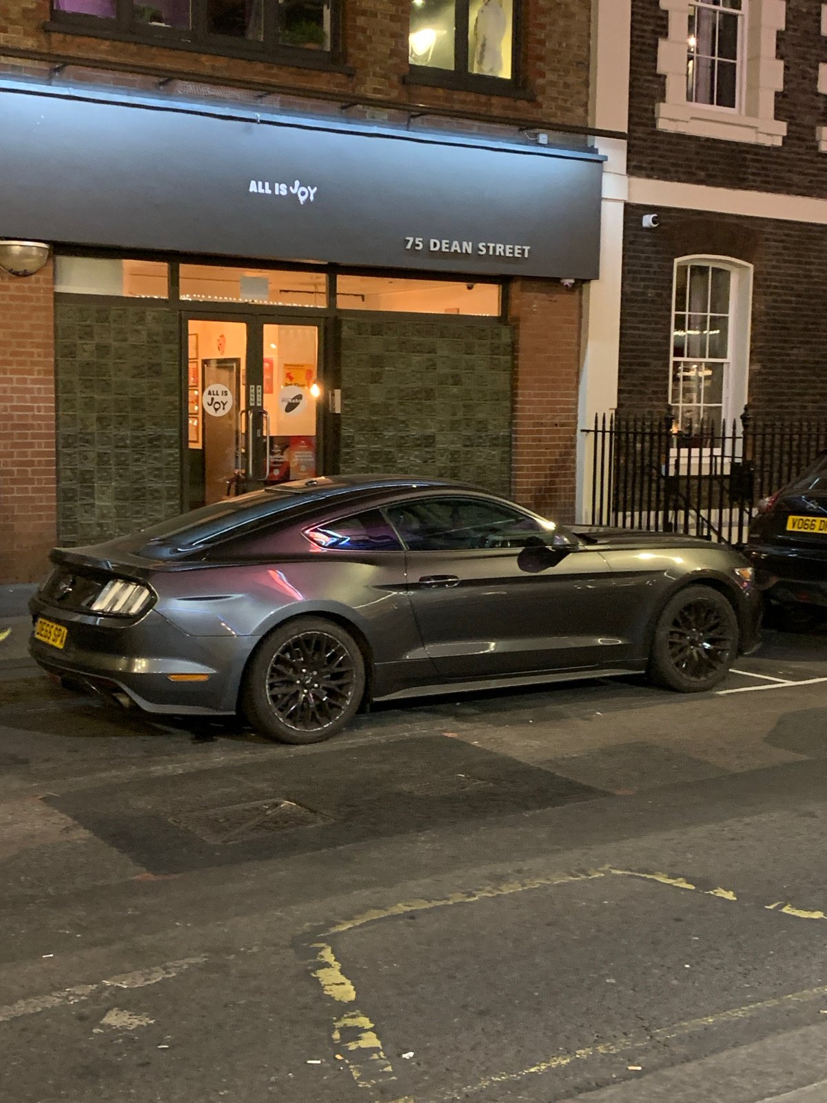 Gray Ford Mustang spotted parked on Dean Street, London