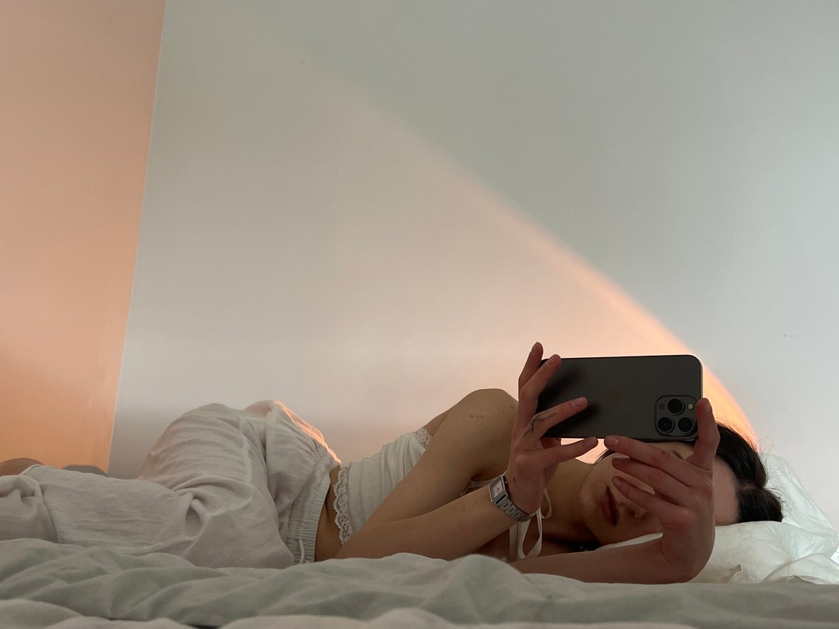 Woman documents morning selfie session in Ternopil bedroom