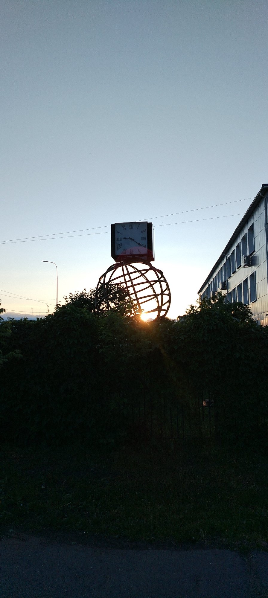 Golden hour documentation captures Chaikovsky's industrial sunsets and garden blooms
