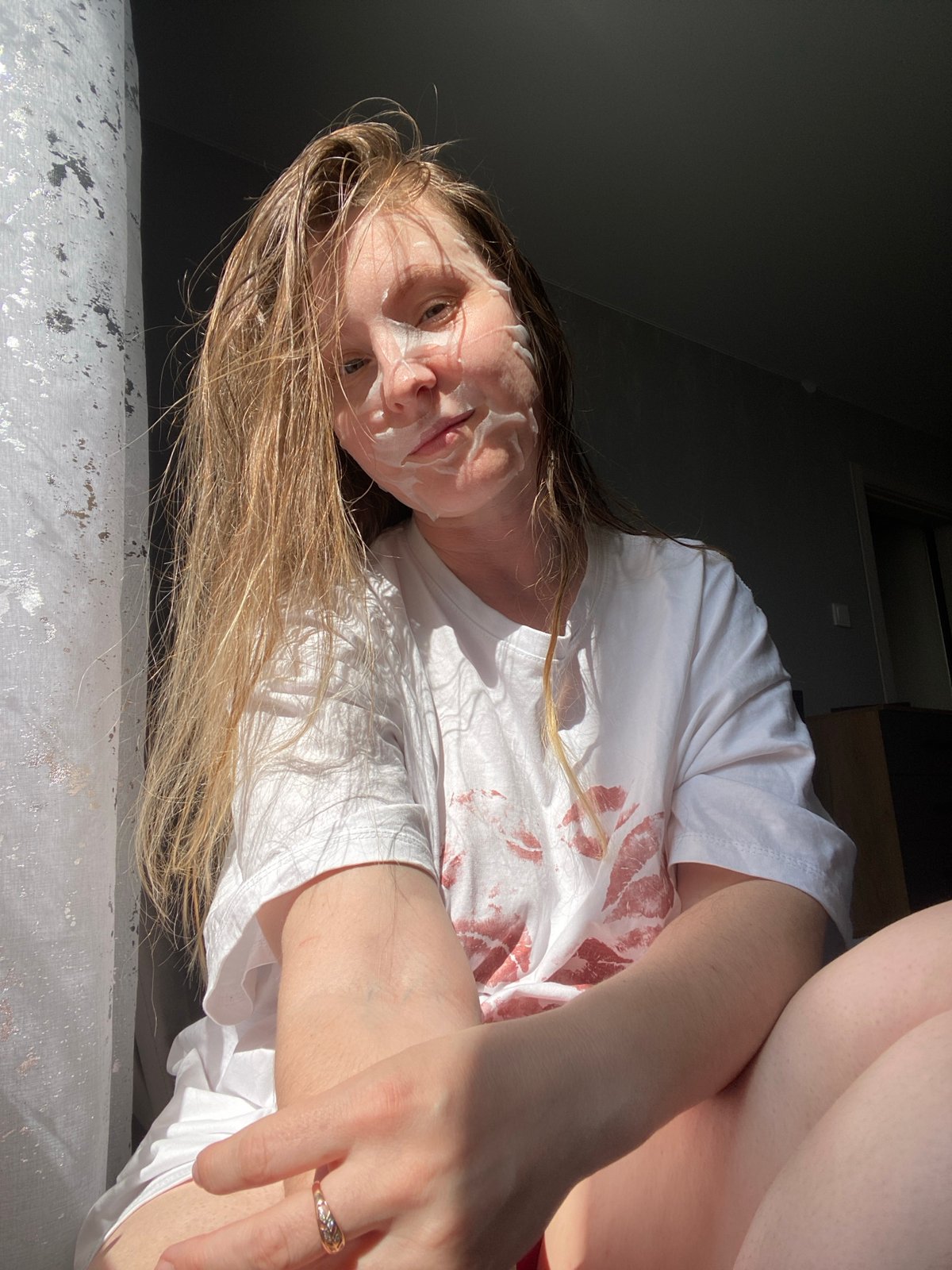 Woman documents skincare routine with facial masks in Noviy