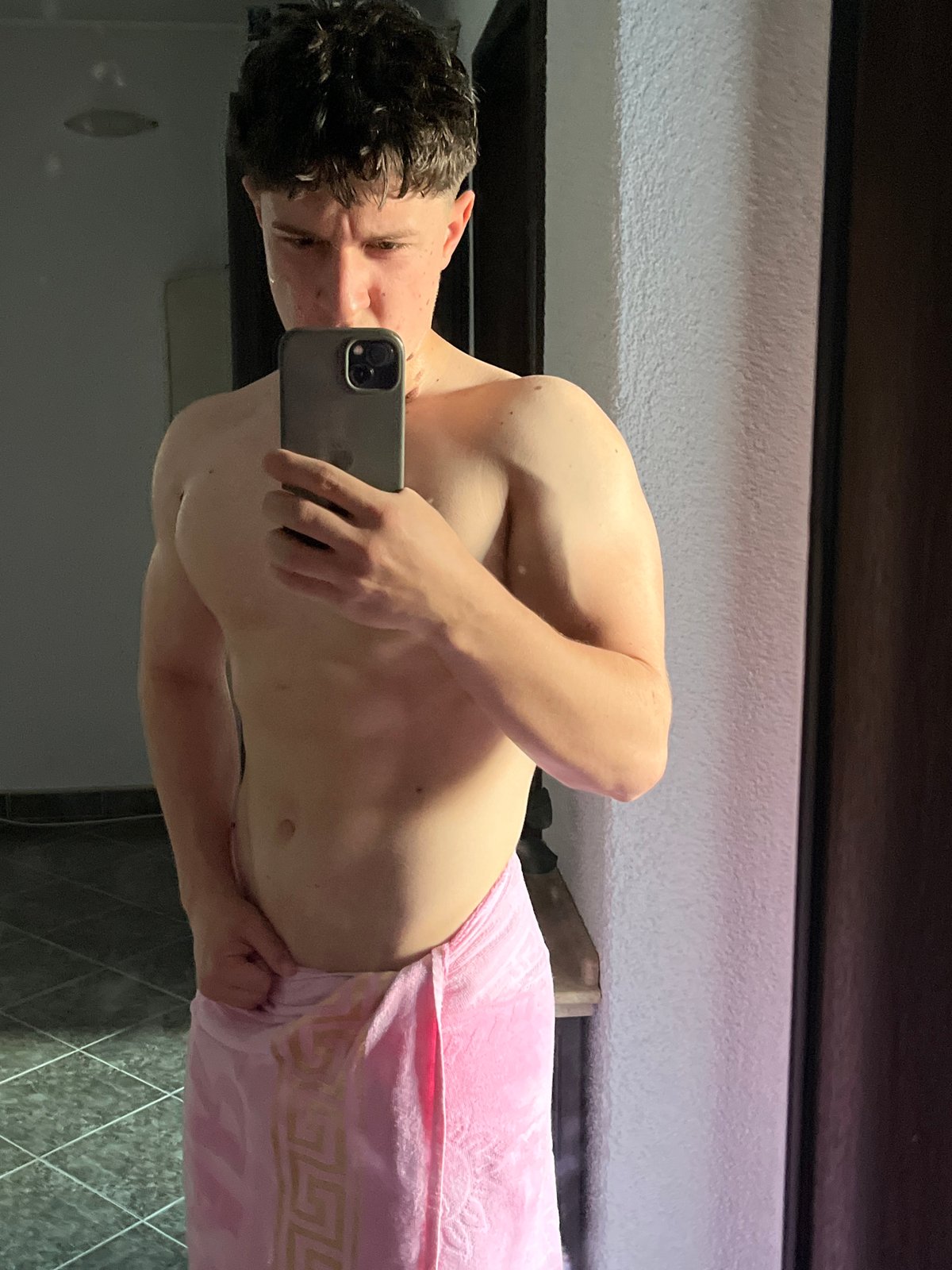 Man takes bathroom mirror selfies in Zlatograd, Bulgaria
