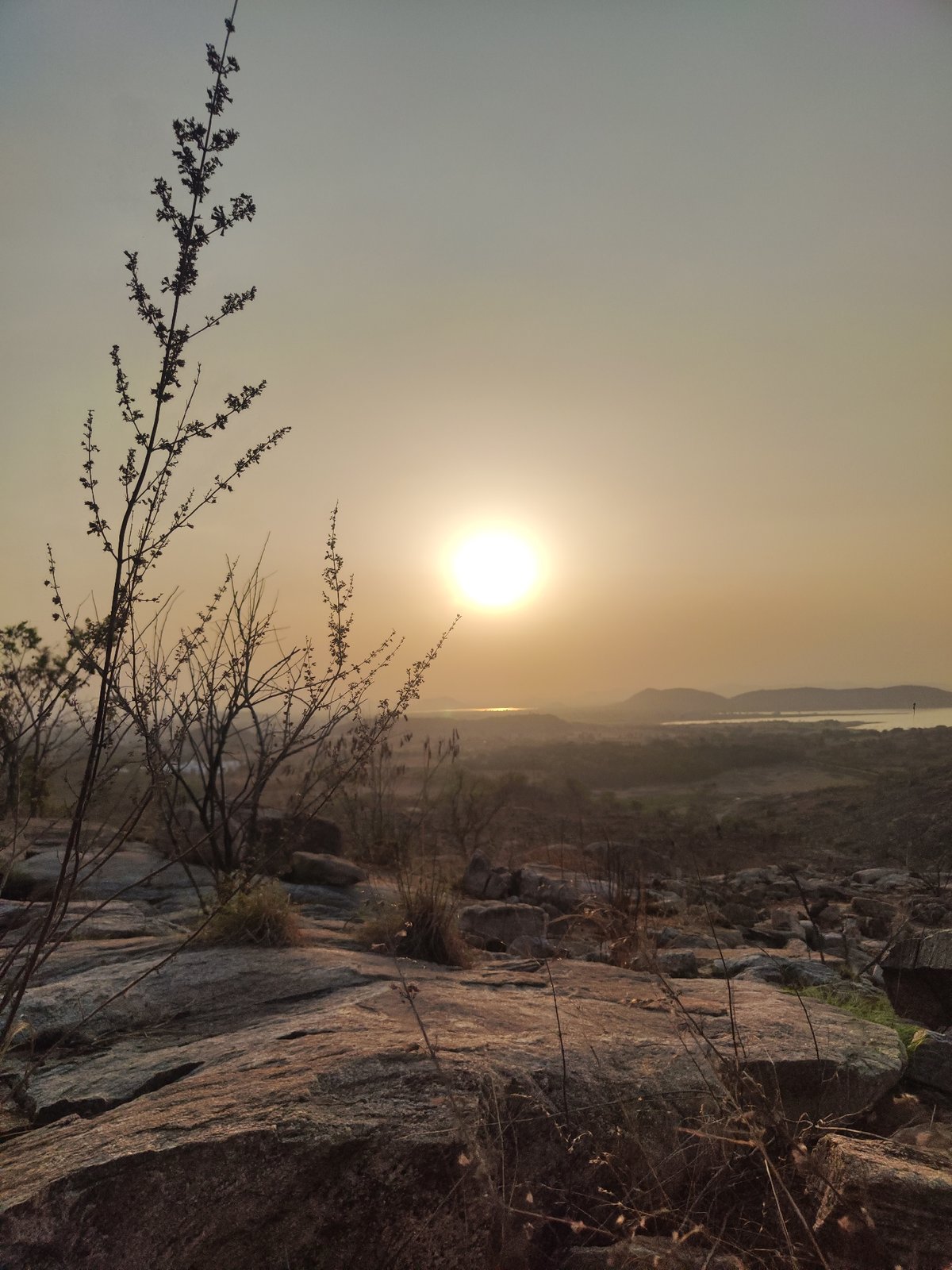 Golden hour photograph captured in Puttaparthi's rocky terrain