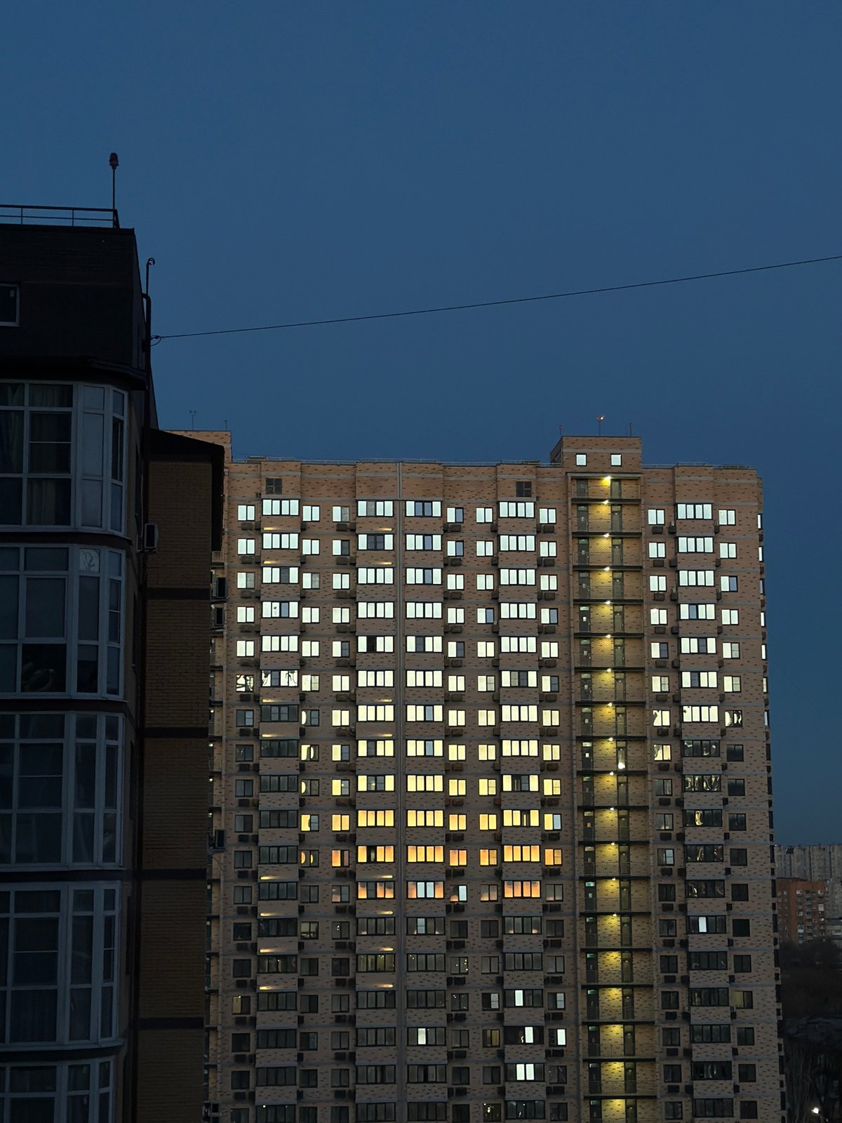 Evening lights illuminate building windows in Rostov-on-Don at dusk
