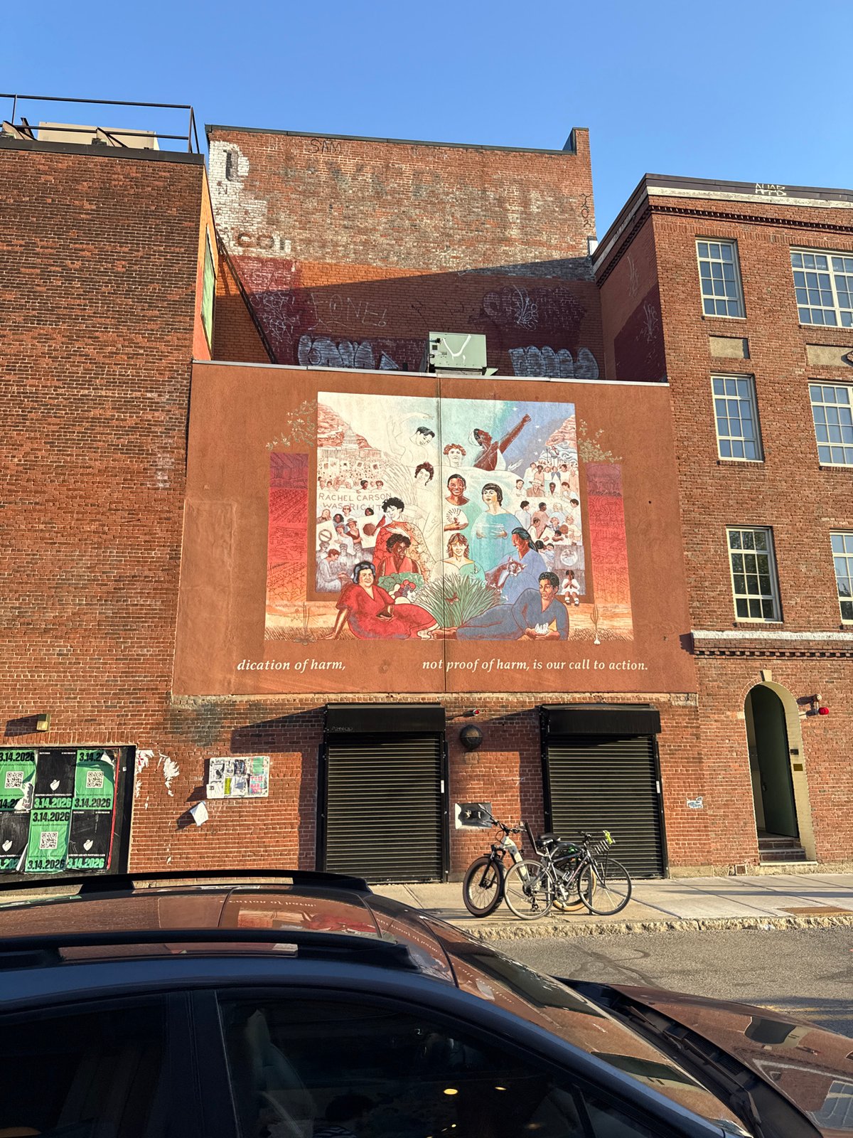 Multi-ethnic mural documented on Cambridge brick building