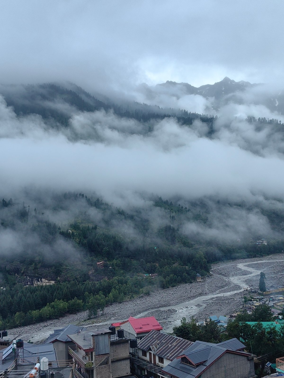 Vashisht wrapped in cloud and fog on a moody mountain morning