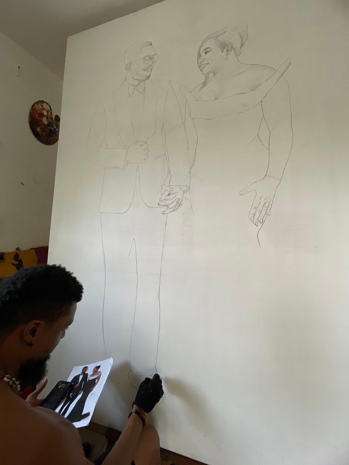 Artist creates large-scale portrait drawings using smartphone reference