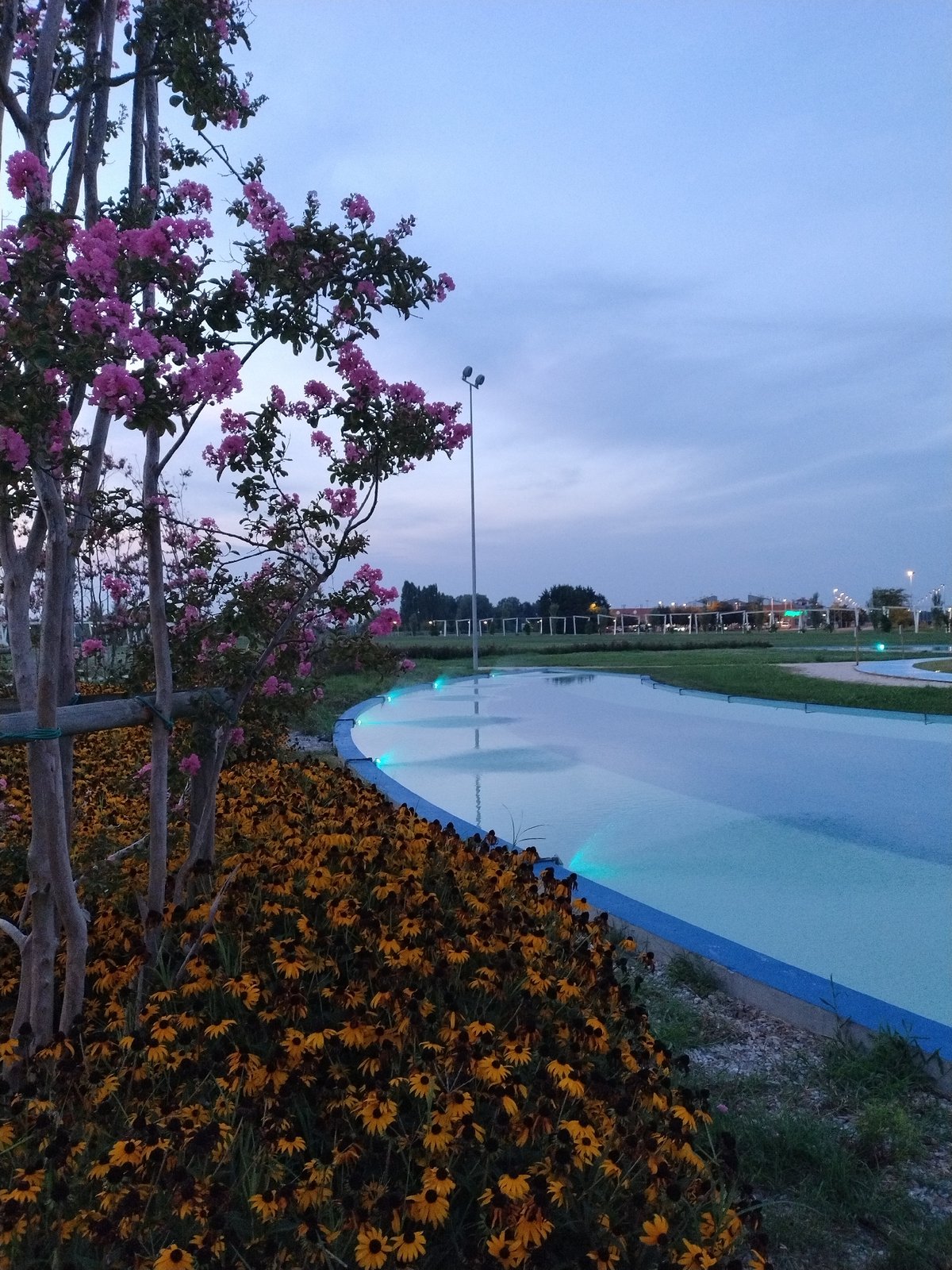 Dusk at a Caorle park and its modern church