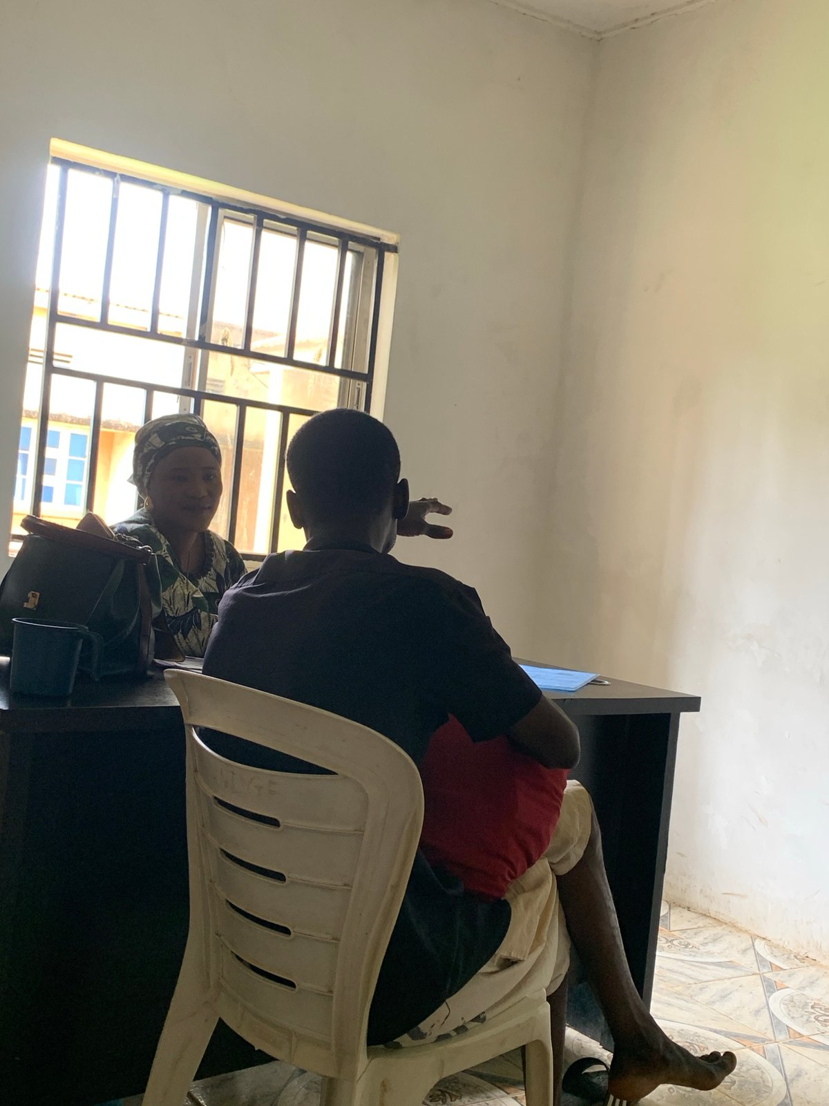 Residents gather indoors in Maigizo, Nigeria morning scenes