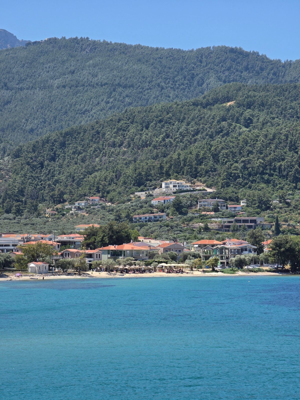 Greek island ferry port on a bright summer morning