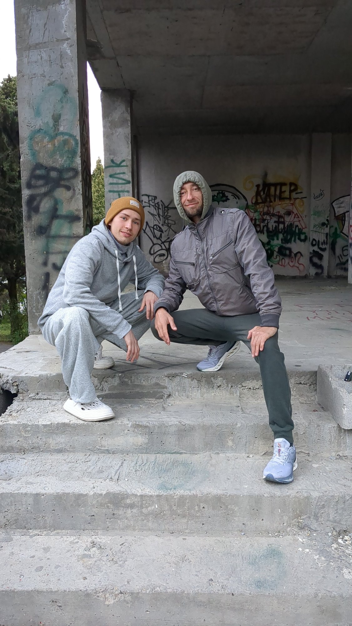 Two people photographed exploring abandoned structures in Gelendzhik