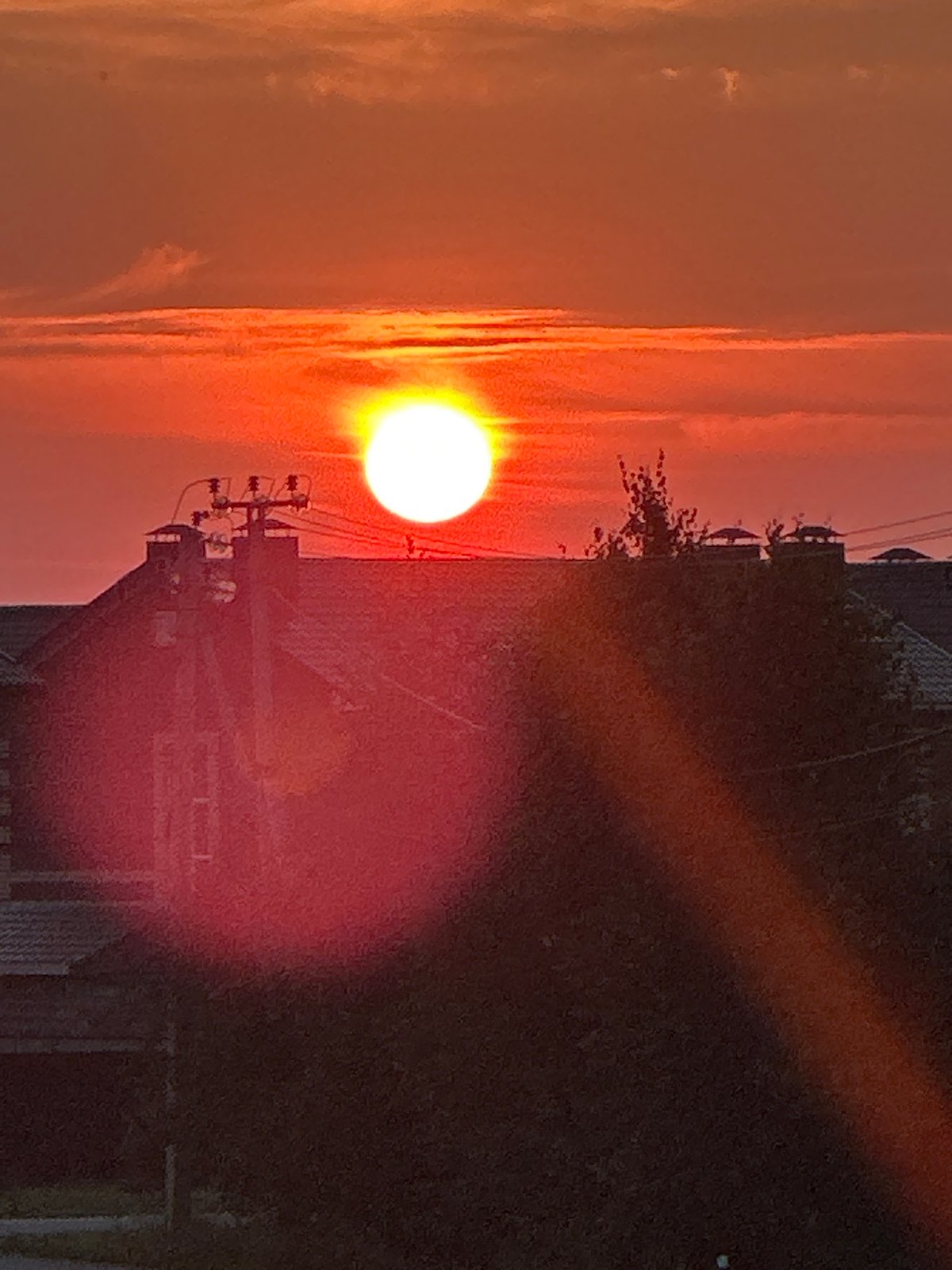 Vivid summer sunset over Zubovo's residential streets