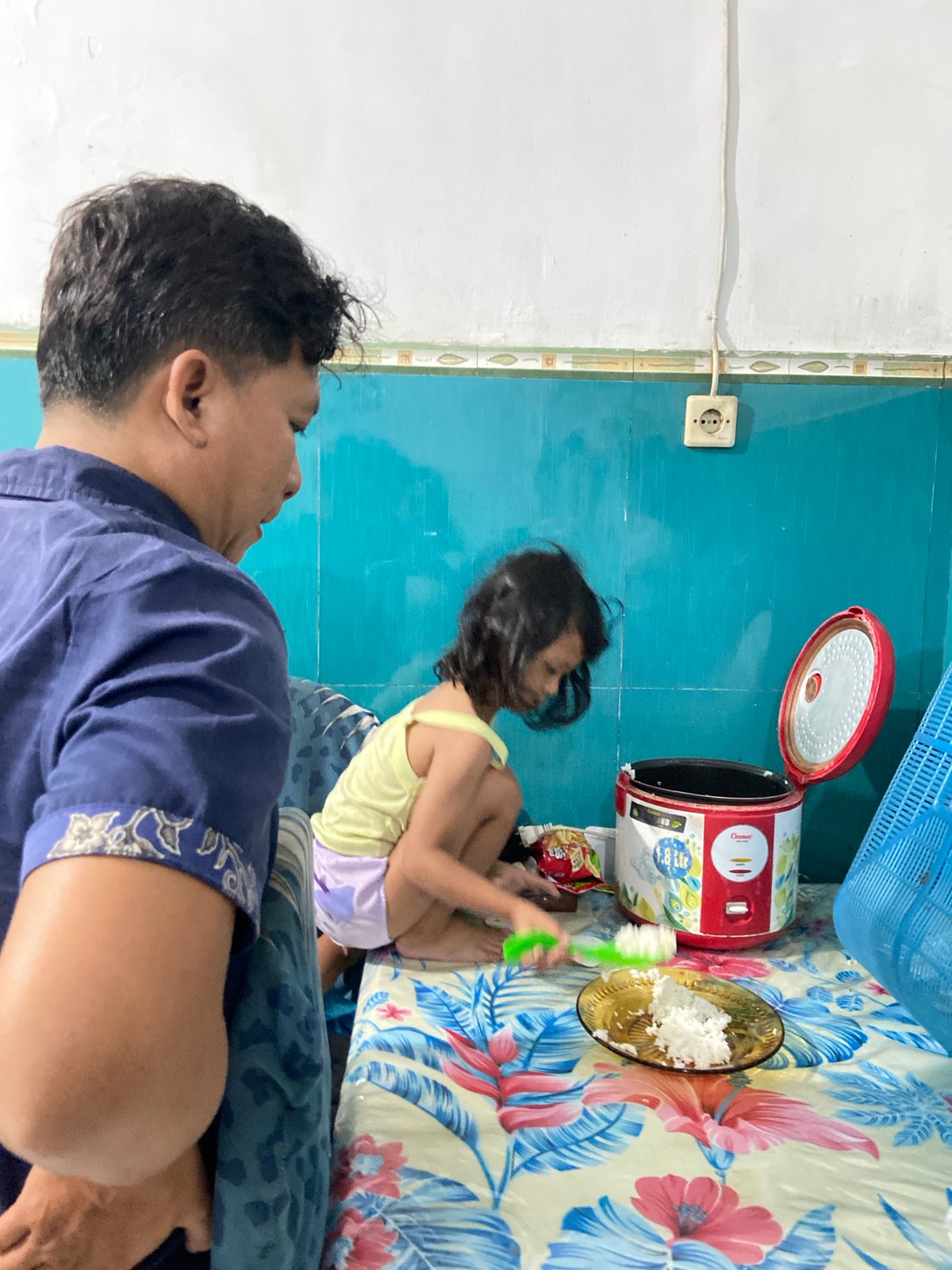 Family meal time captured in Gelam, Indonesia home