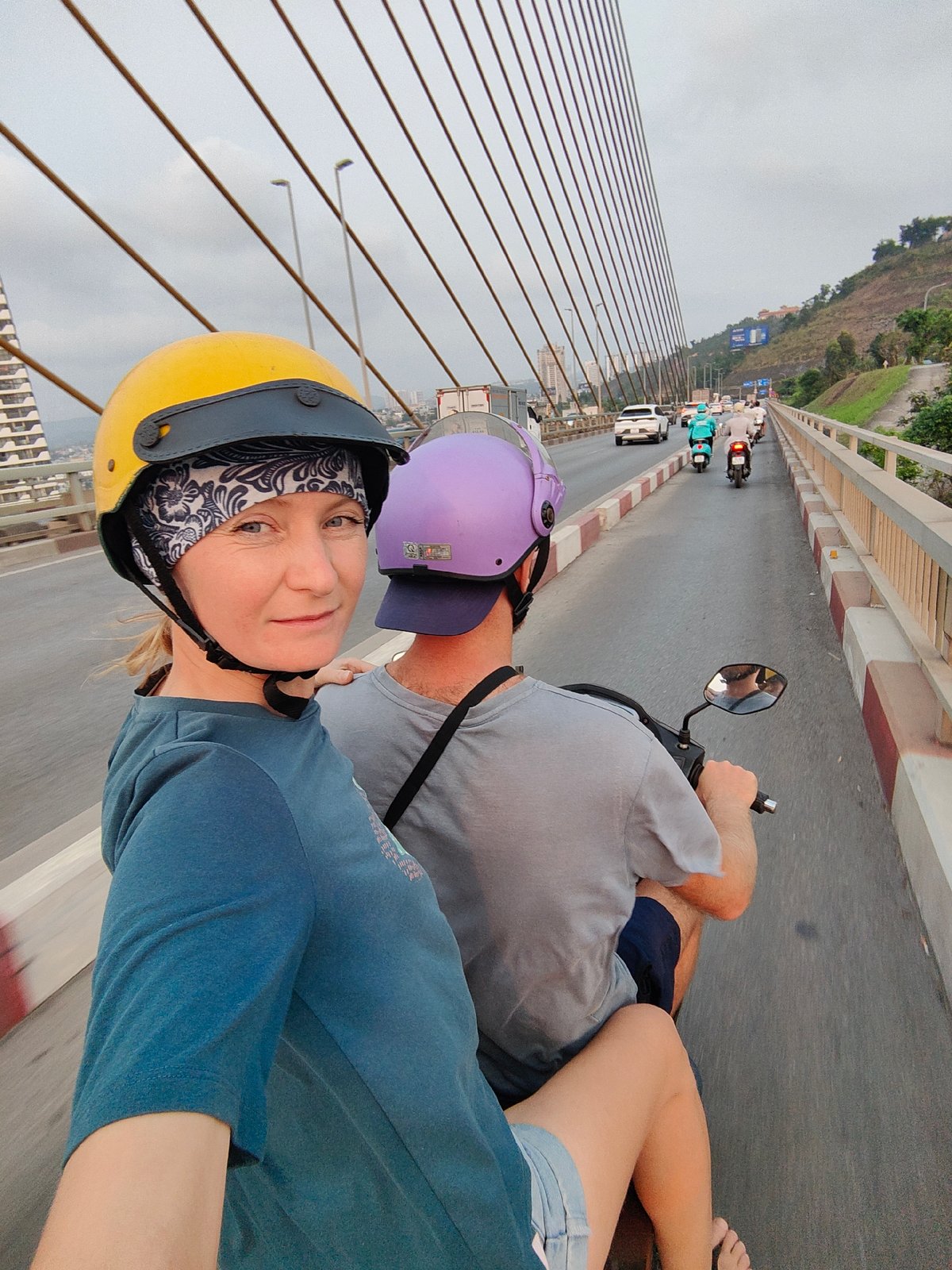 Scooter riders cross Bai Chay Bridge in Vietnam