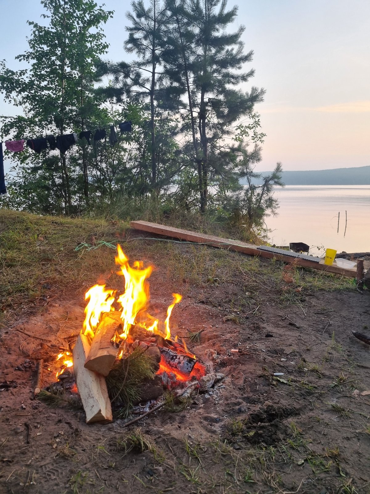 Campfire on the Kama River shore at dusk, Chaykovsky