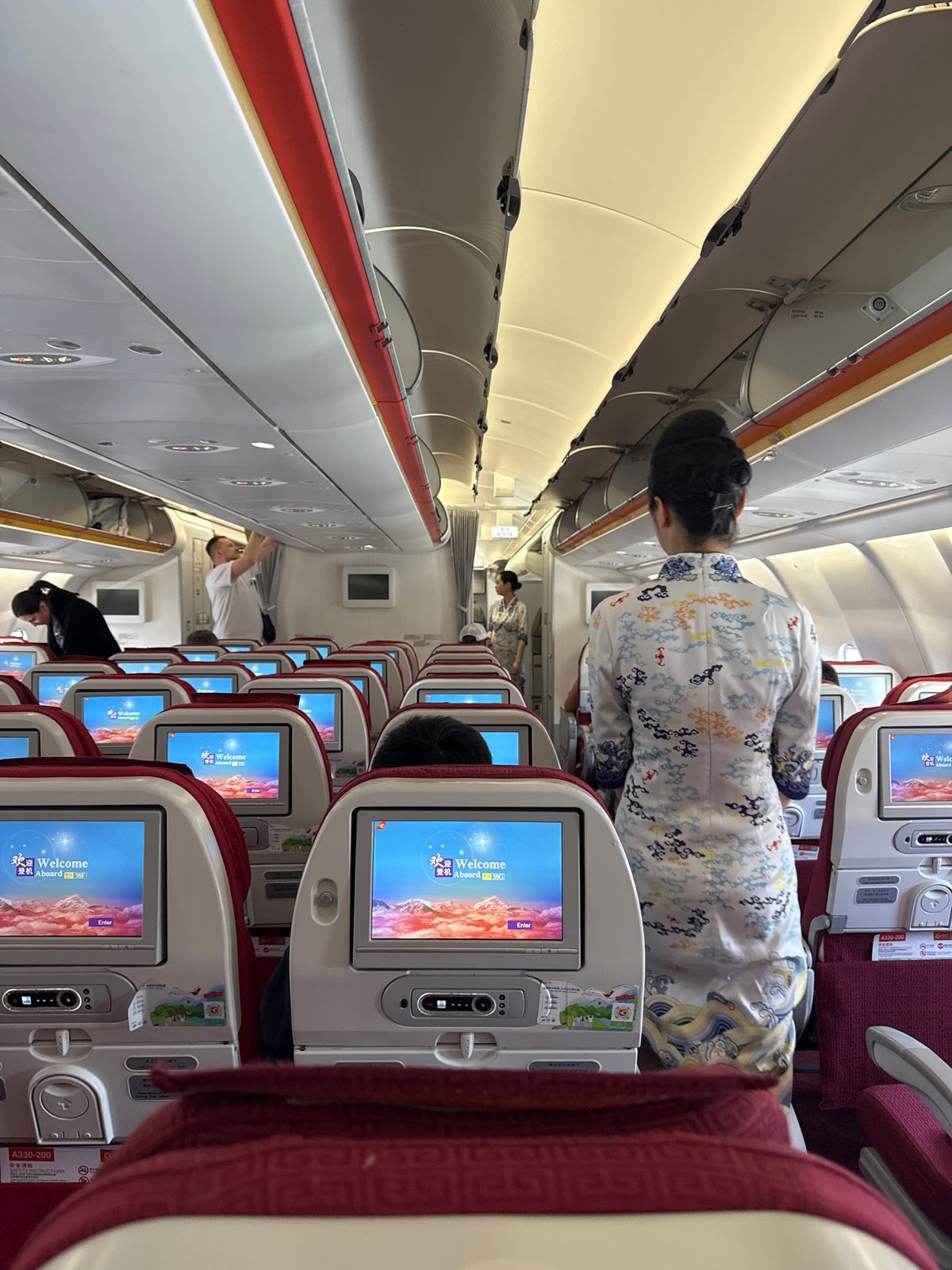 Passenger captures airplane cabin interior during boarding process