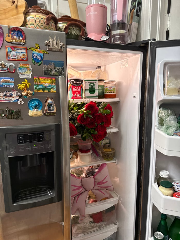 Woman stores, smells roses in refrigerator in Naples home