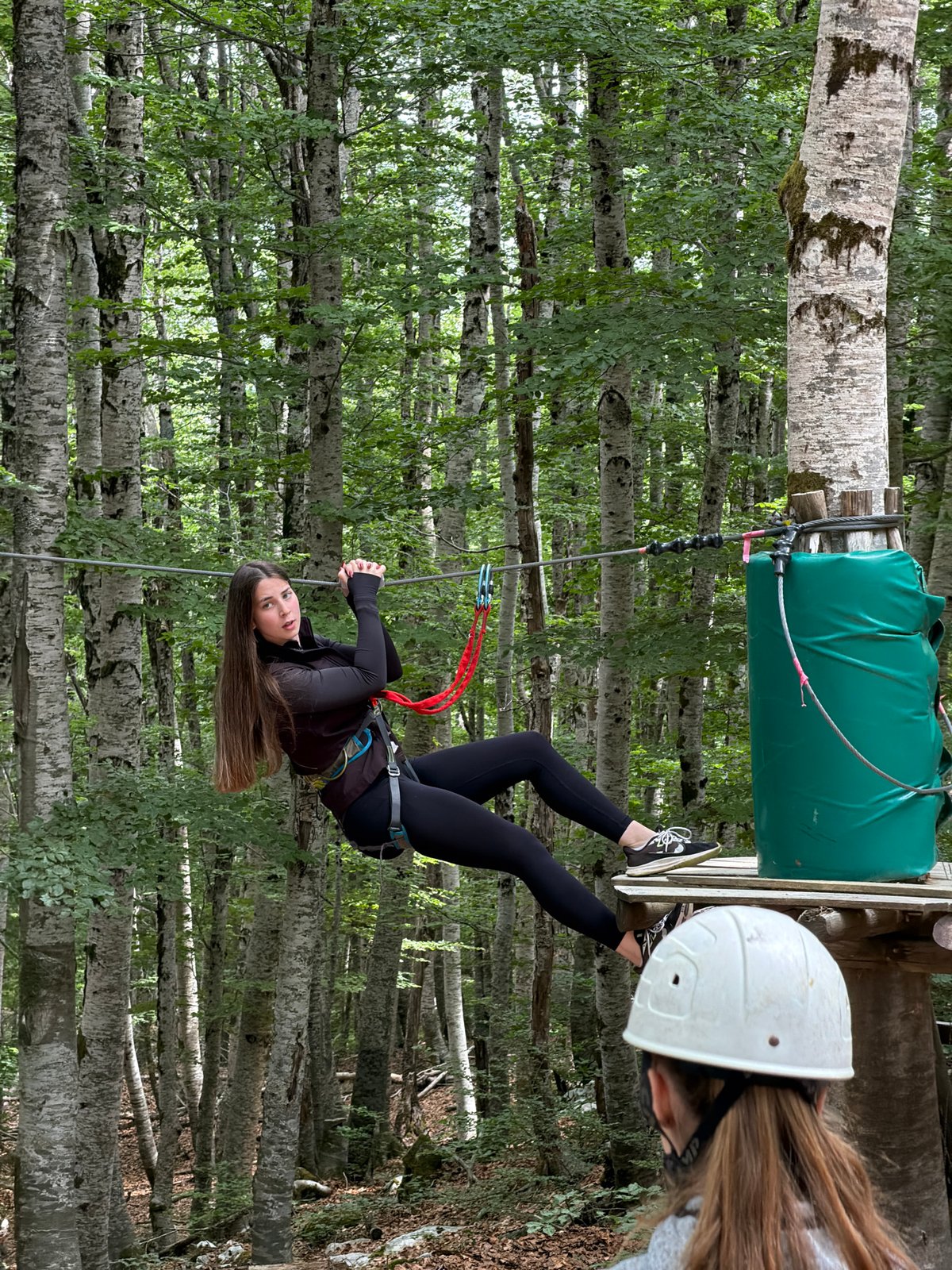 Girl enjoys zipline adventure at Montenegro forest park