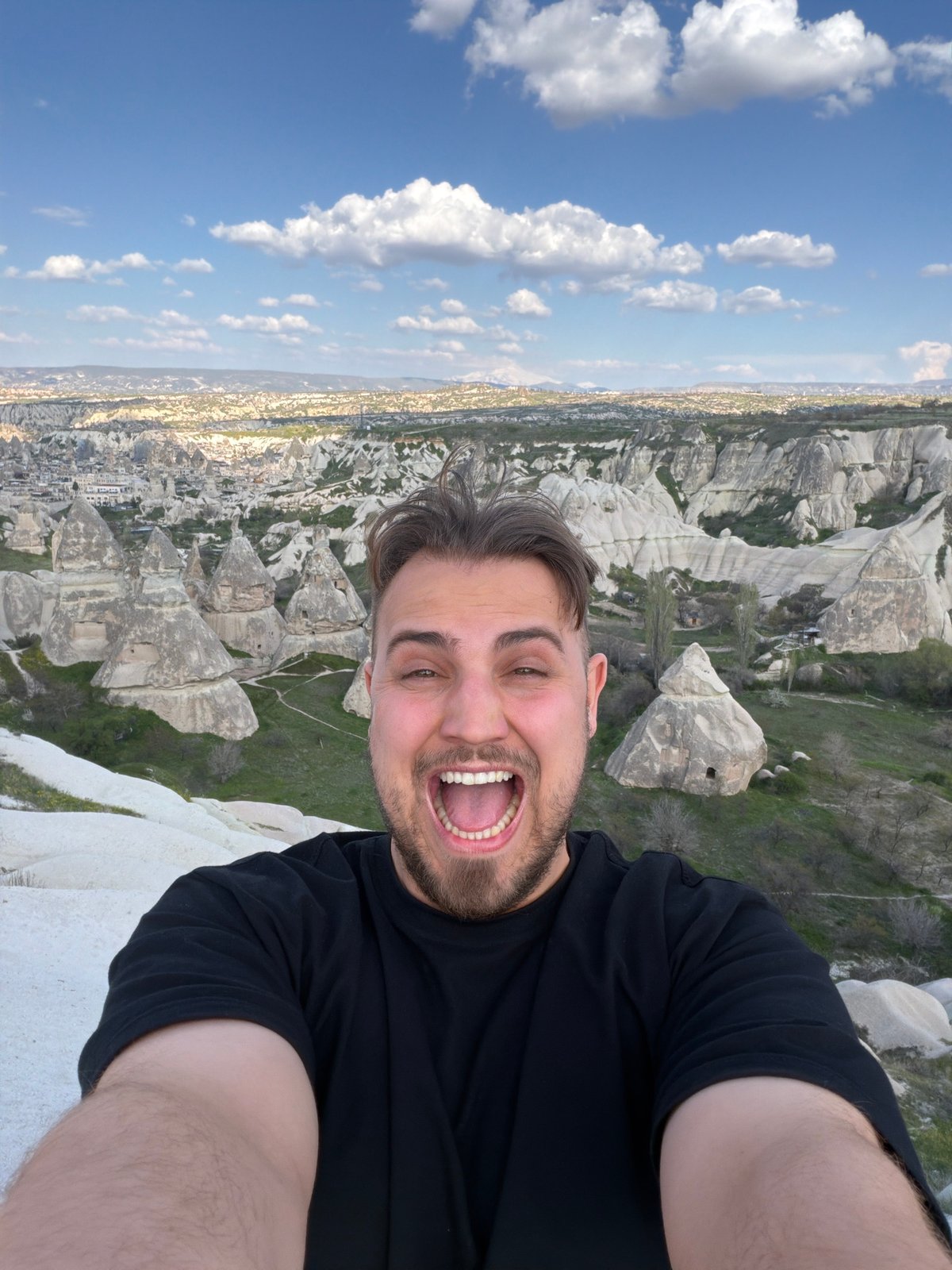 Tourist captures Cappadocia's fairy chimney formations in Turkey selfie