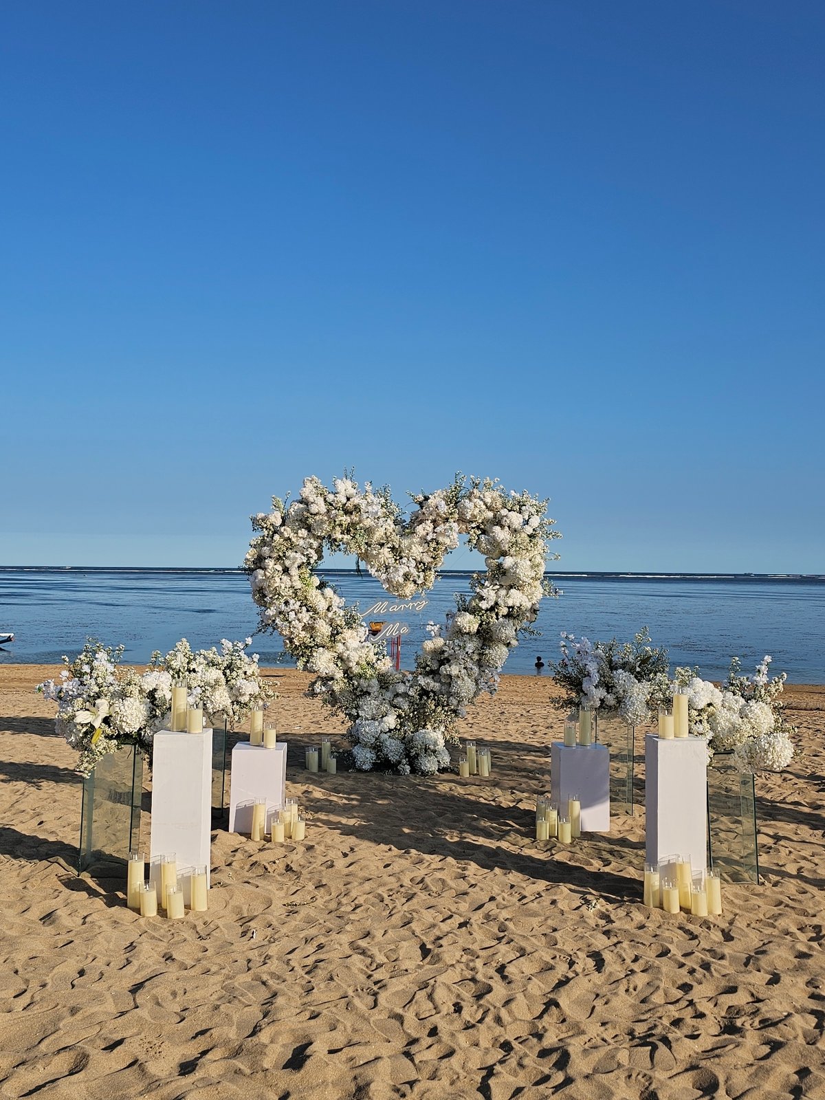 Beach wedding preparations and leisure activities documented in Denpasar