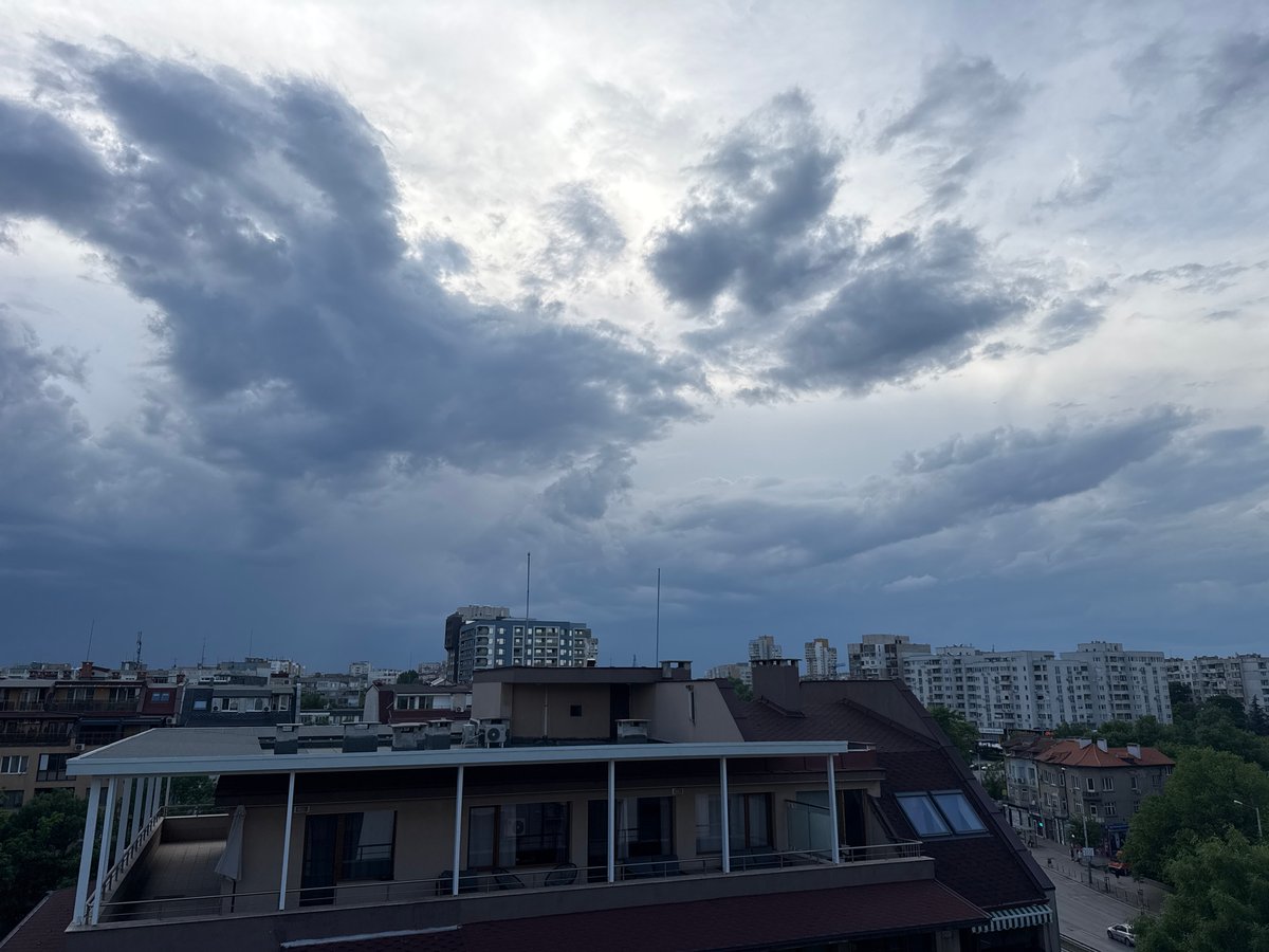 Dark storm clouds gather over urban area