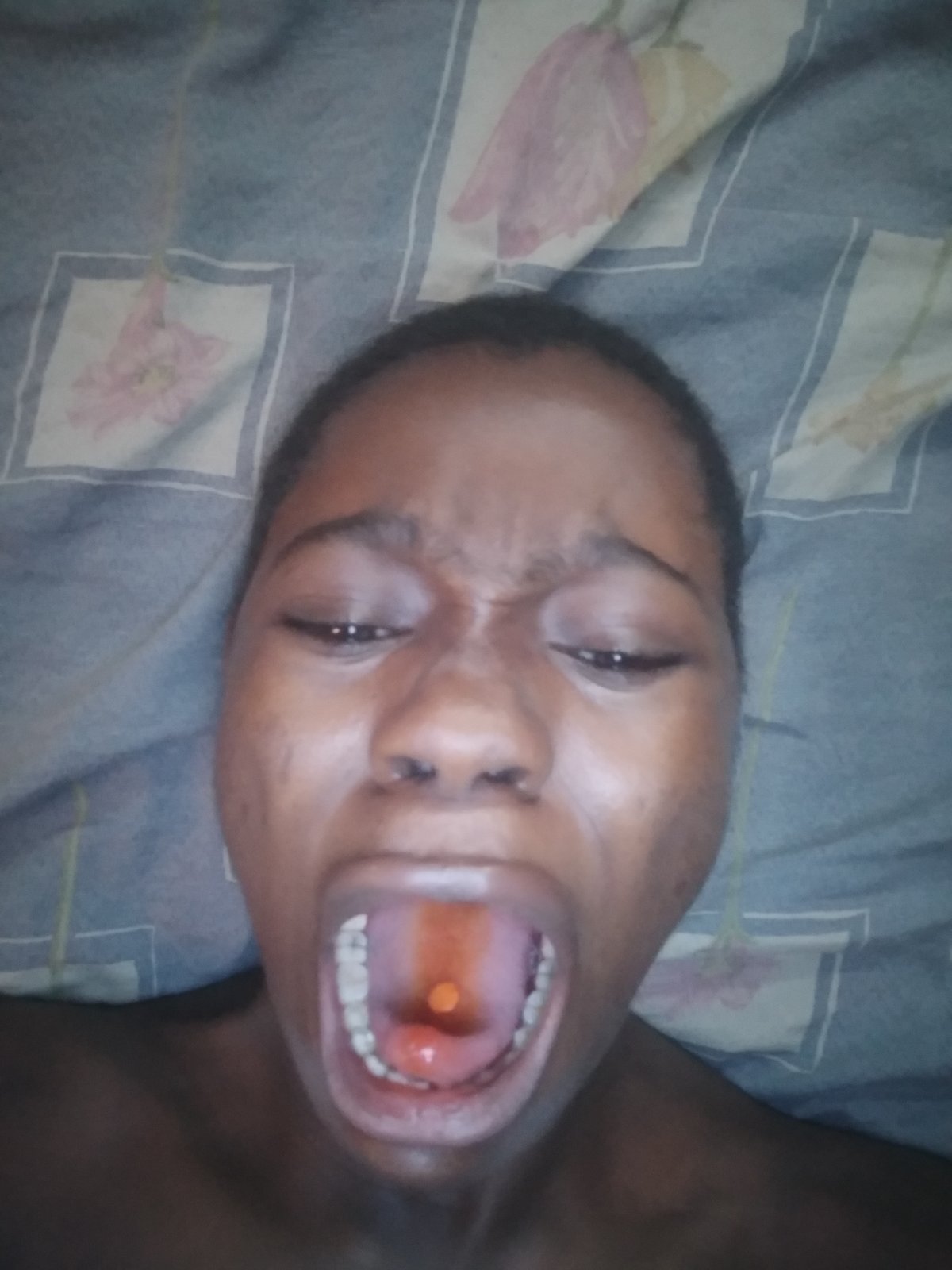 Person Takes Orange Medication in Documented Indoor Session