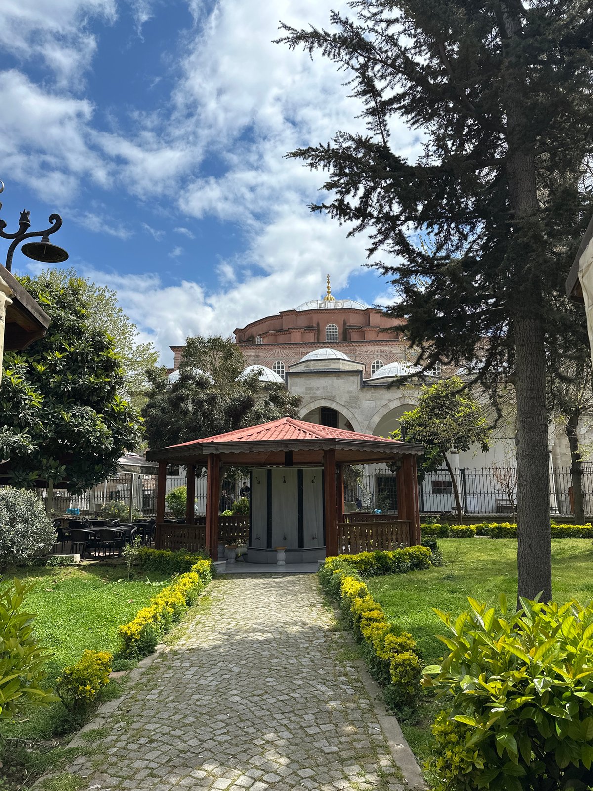 Historic Istanbul site visited during sunny morning with helicopter overhead