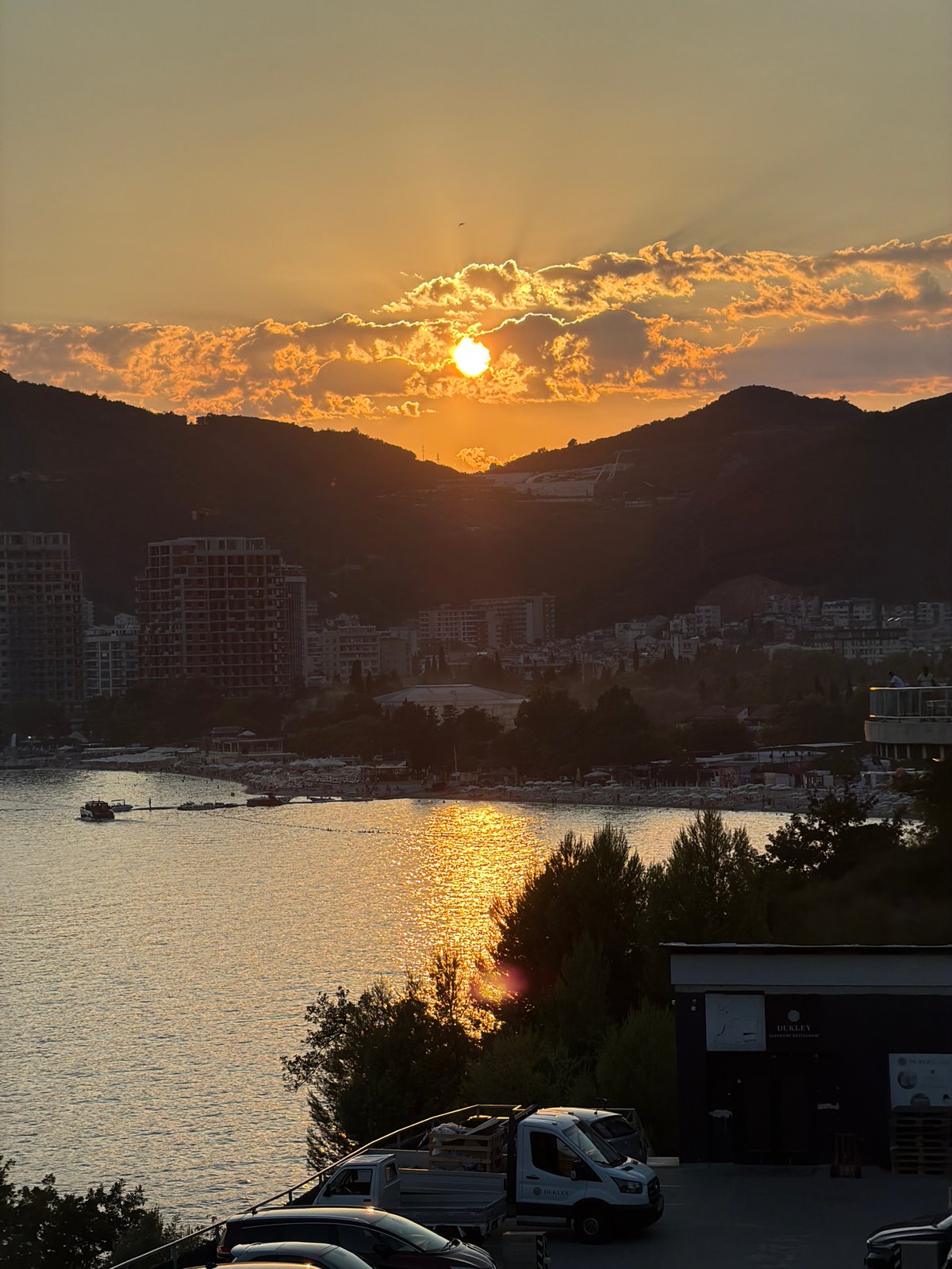 Golden sunset over Boreti's coastline and hillside resort