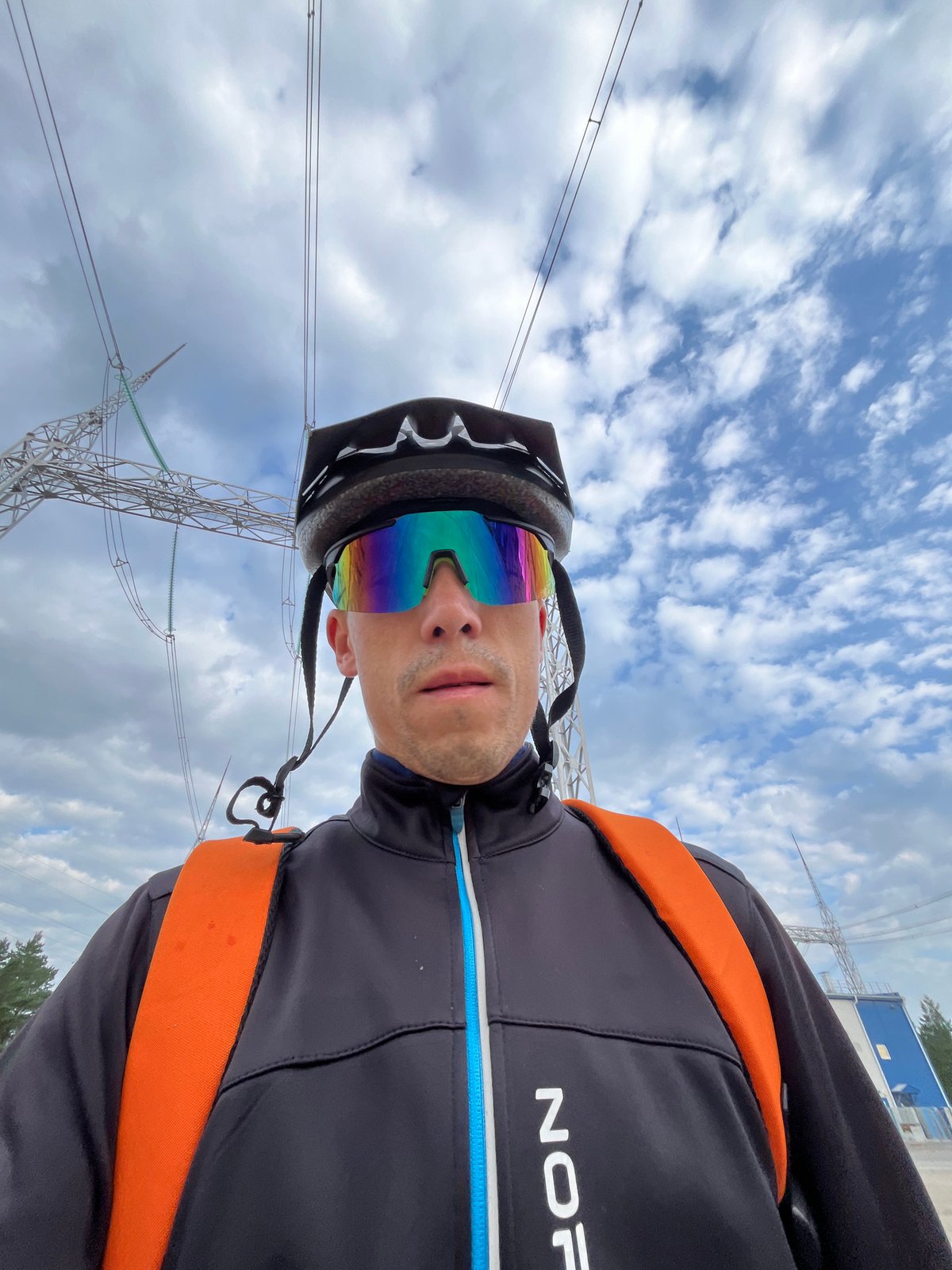 Cyclist stops for selfies at a substation in Chaikovsky