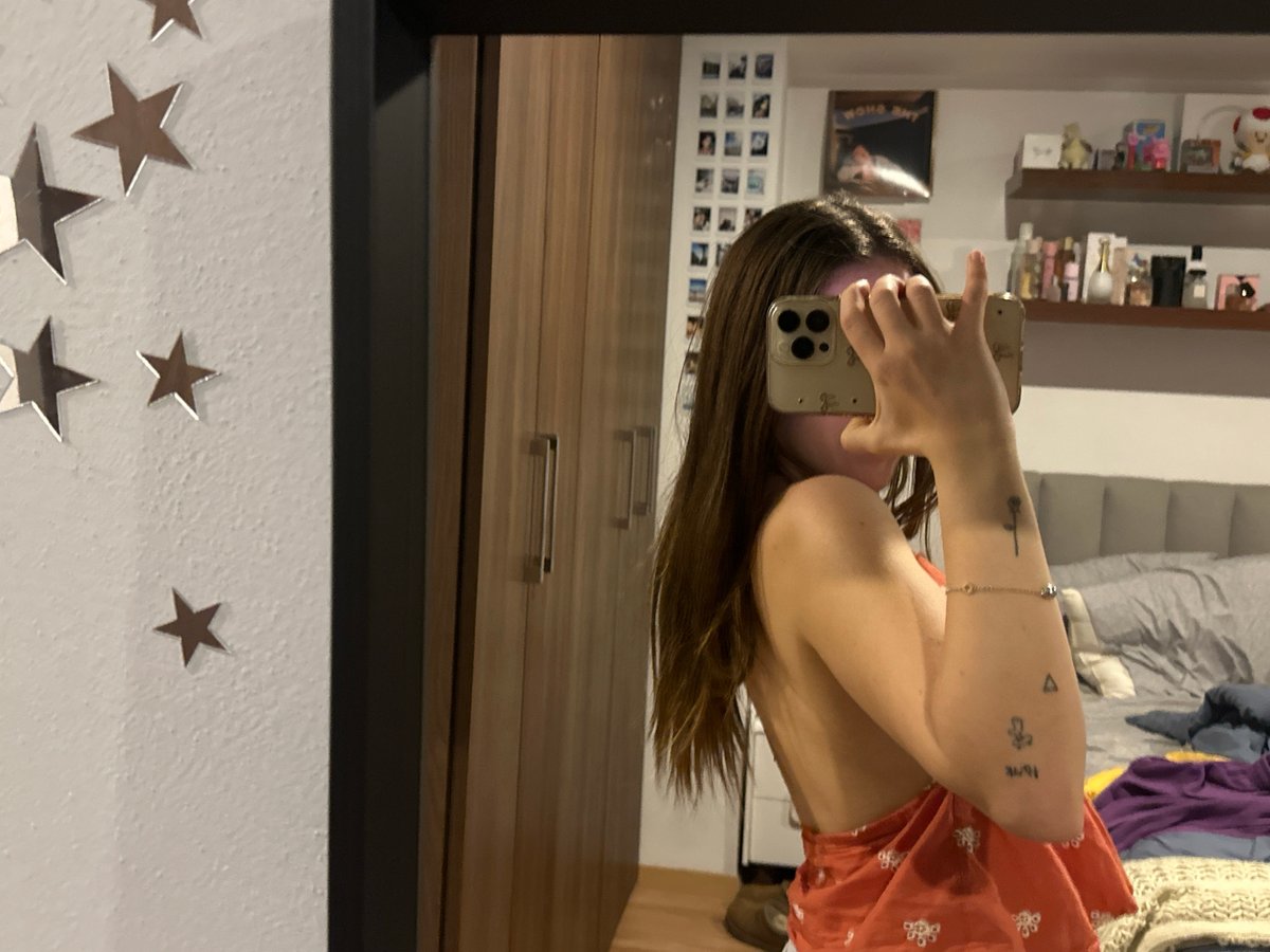 Person takes mirror selfies in Mexican bedroom early morning