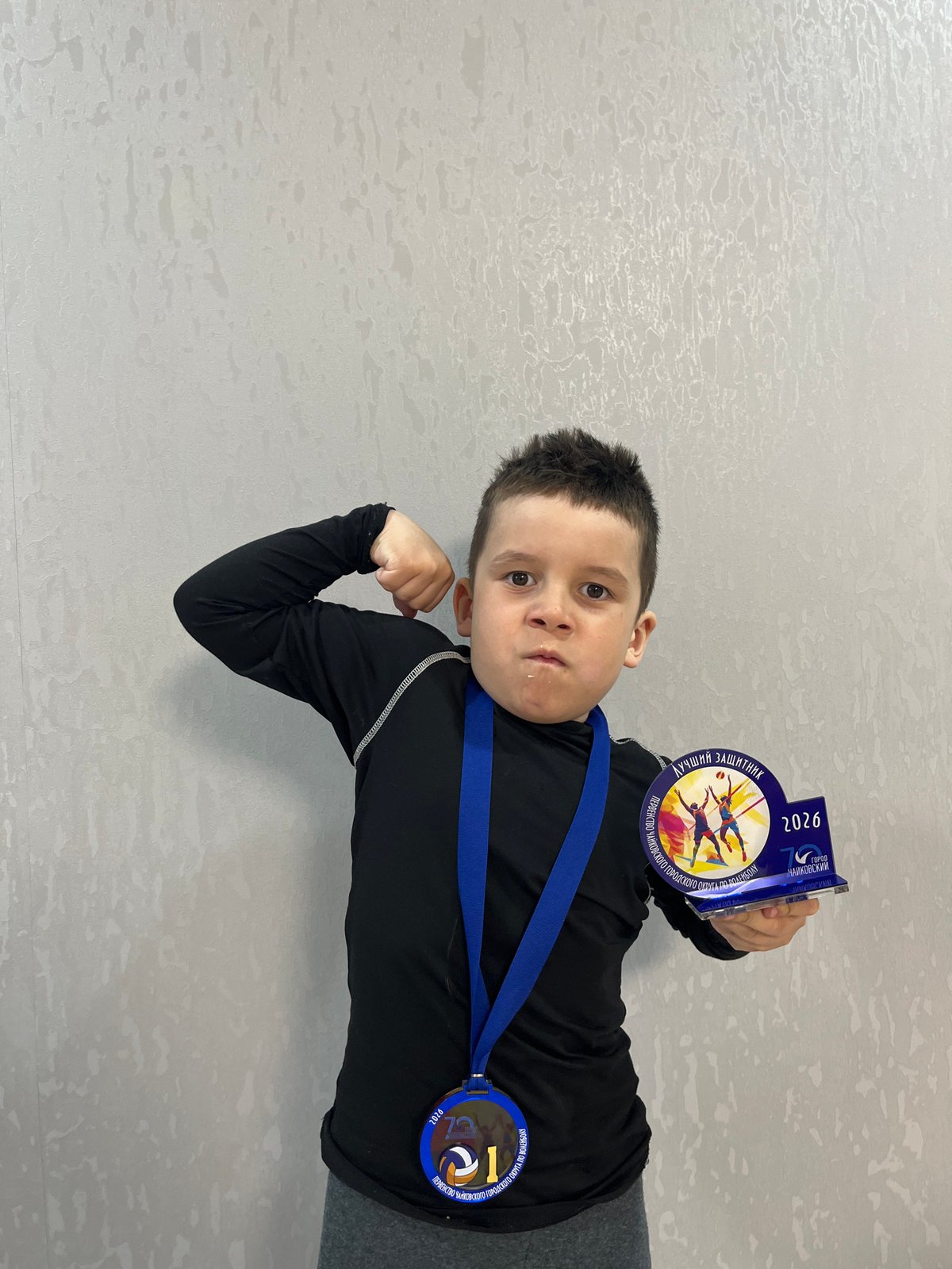 Children celebrate volleyball championship medals in Chaikovsky, Russia