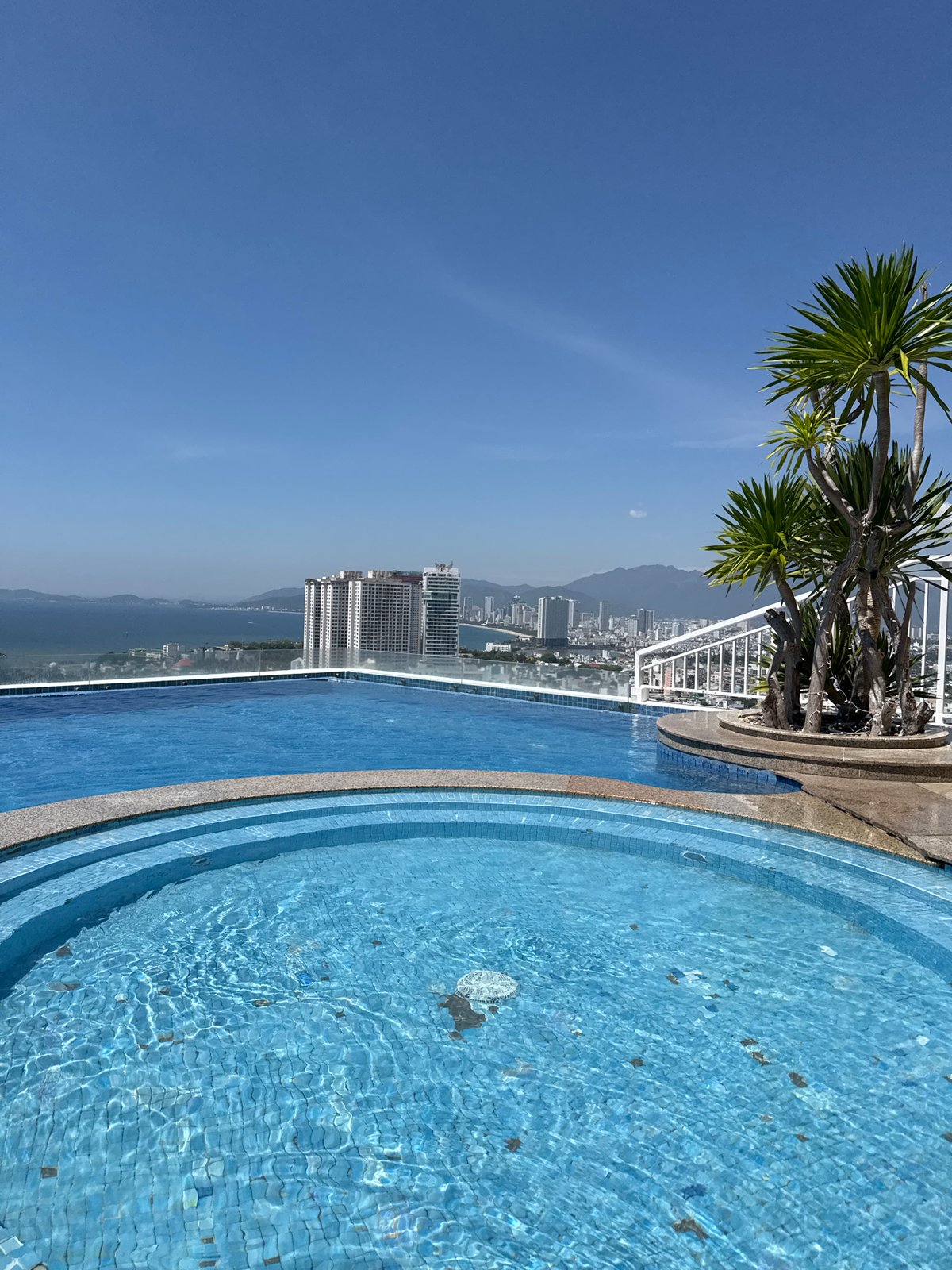 Street-level and rooftop views across a sunny Nha Trang morning