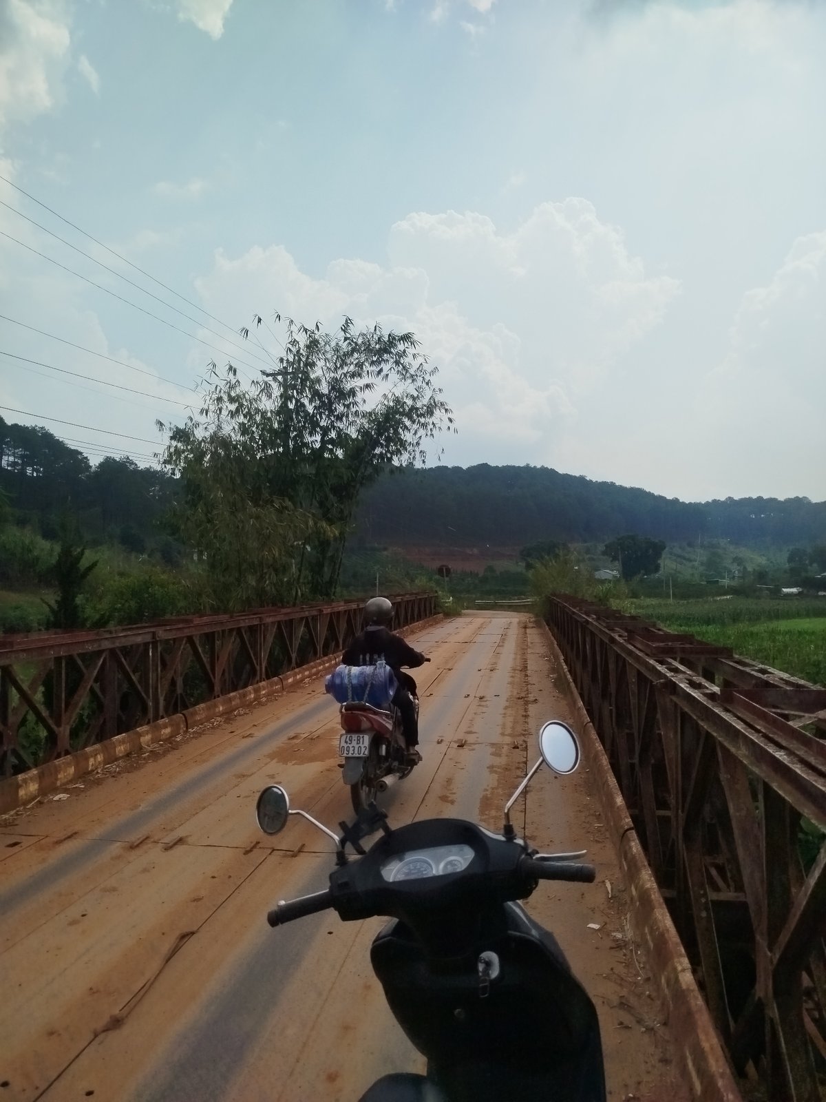 Rural Vietnam landscape and bridge crossing documented by witness