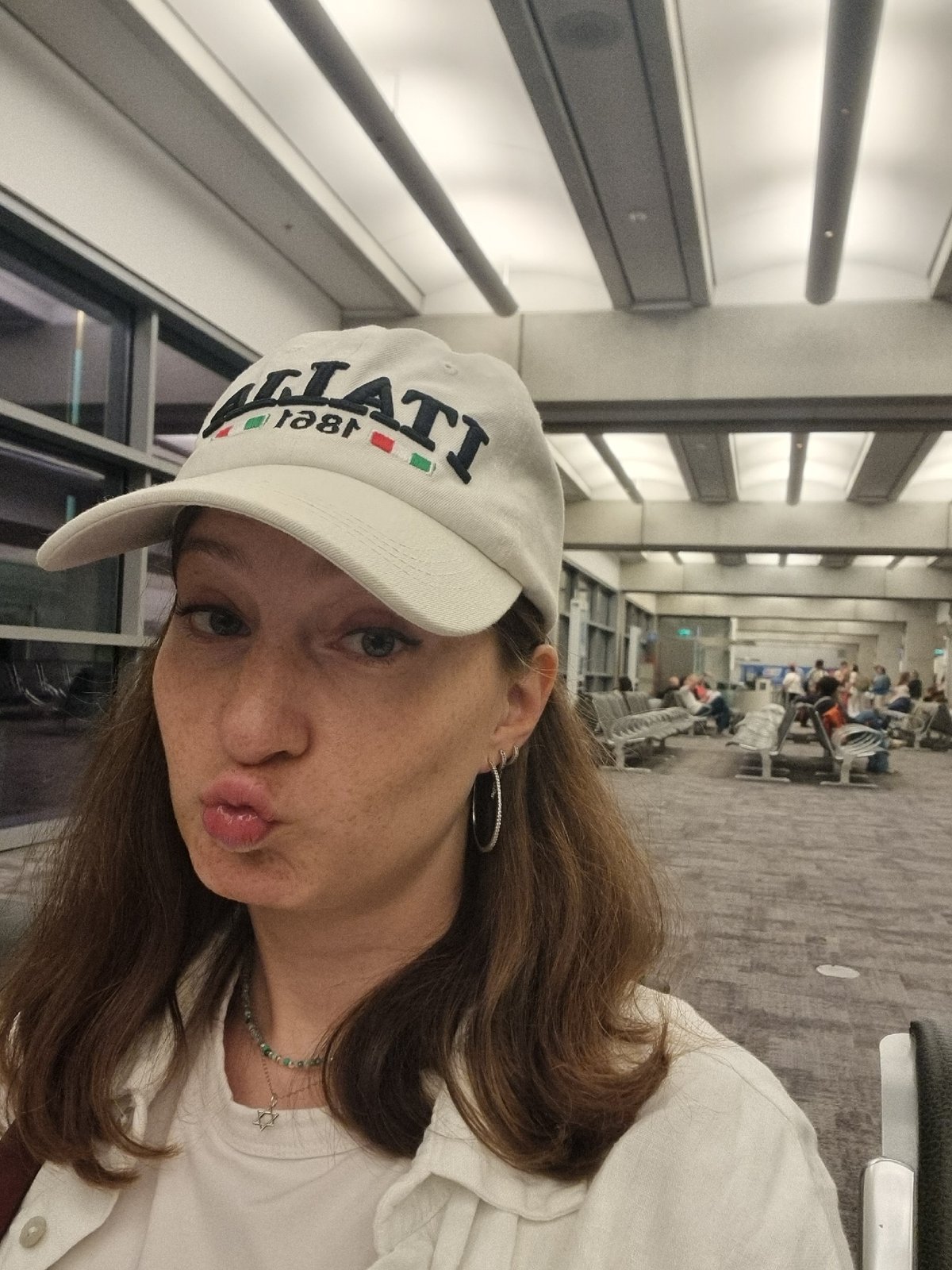 Woman in Italian cap spotted indoors in Tel Aviv