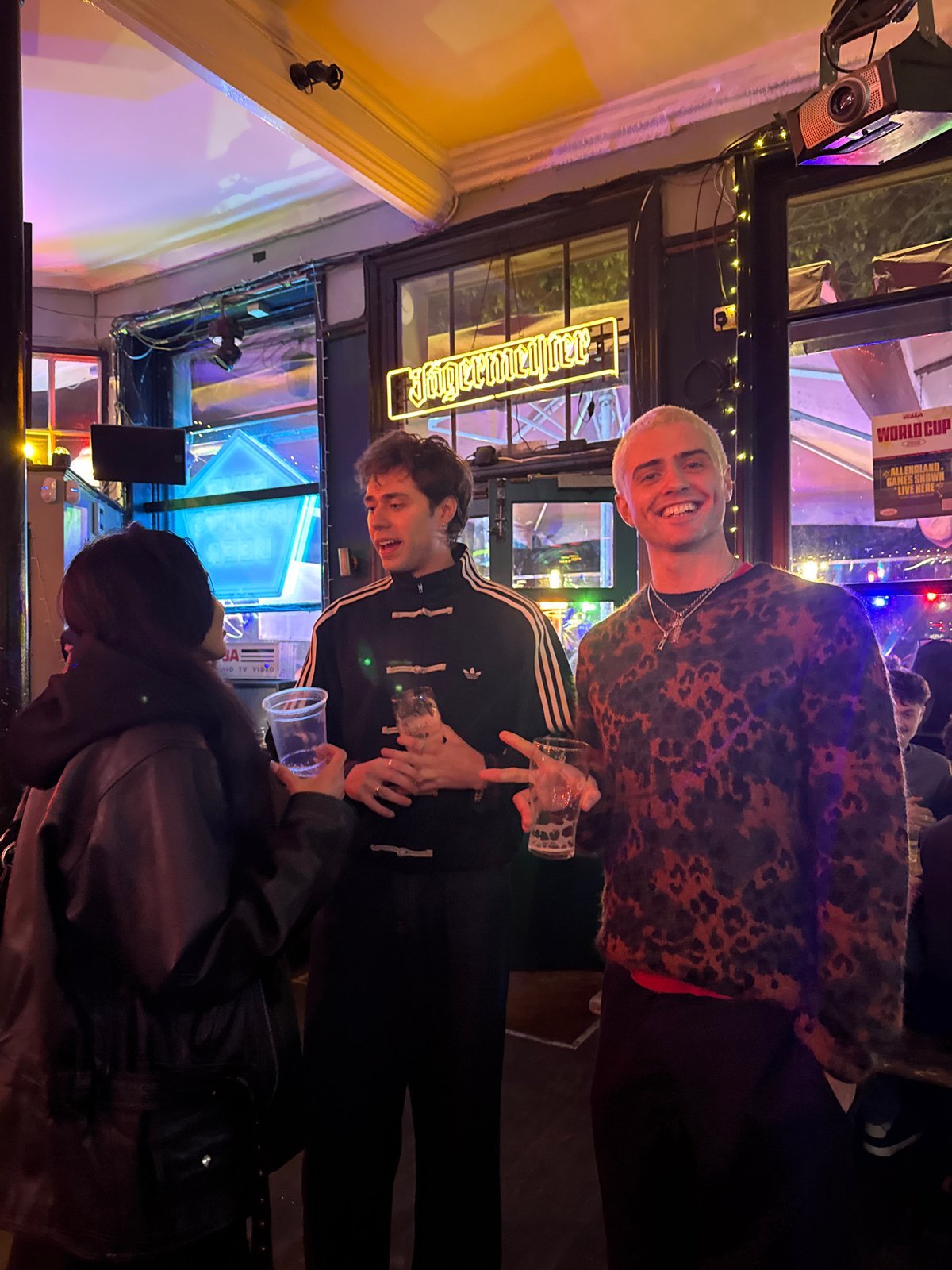 Three people spotted at London pub beneath Jägermeister sign