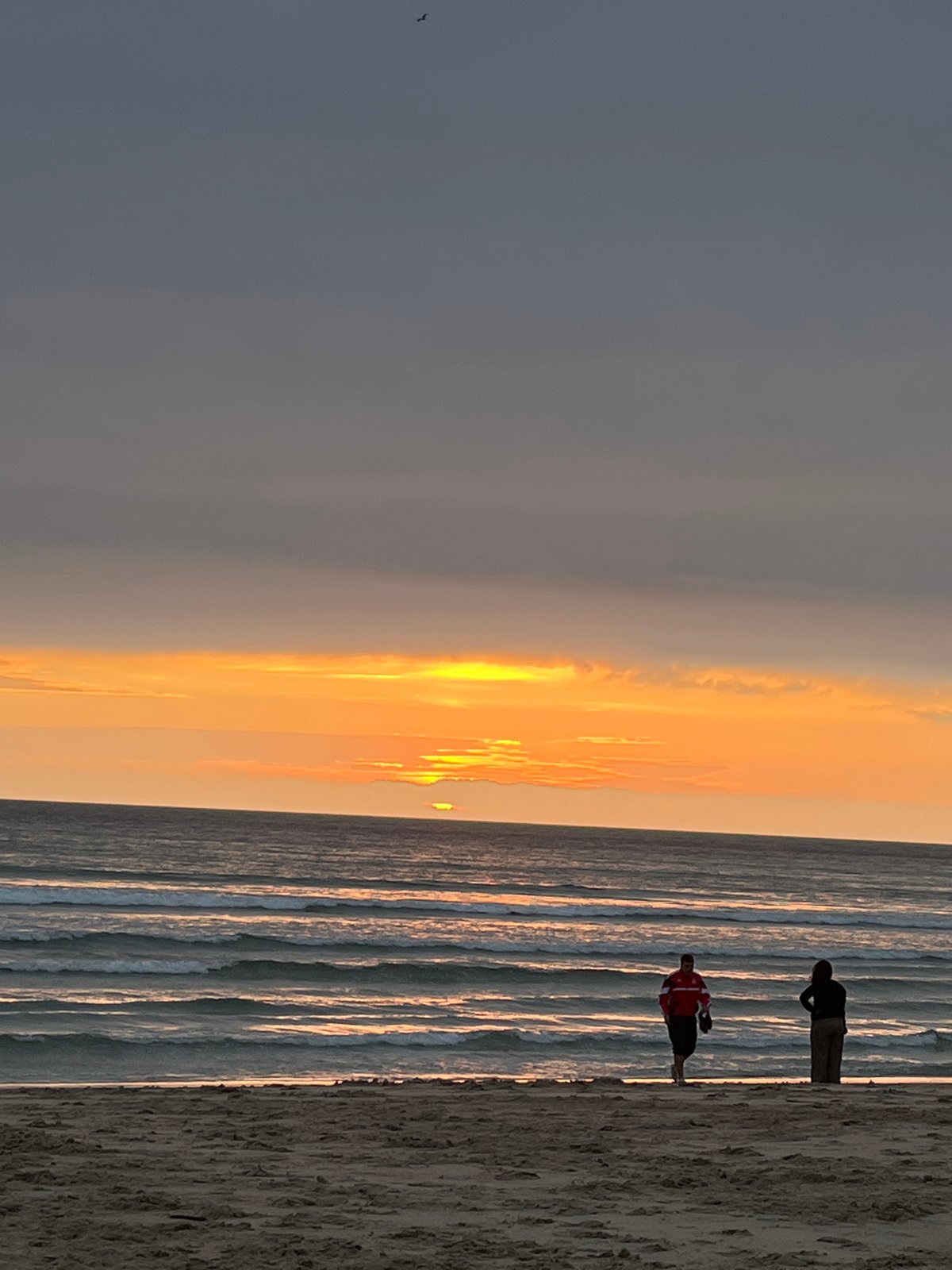 Sunset beach walk captured in A Coruña, Spain