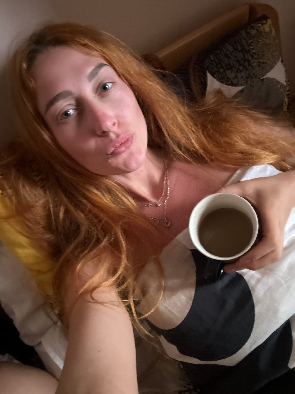 Woman Takes Morning Selfies in Budva Bedroom
