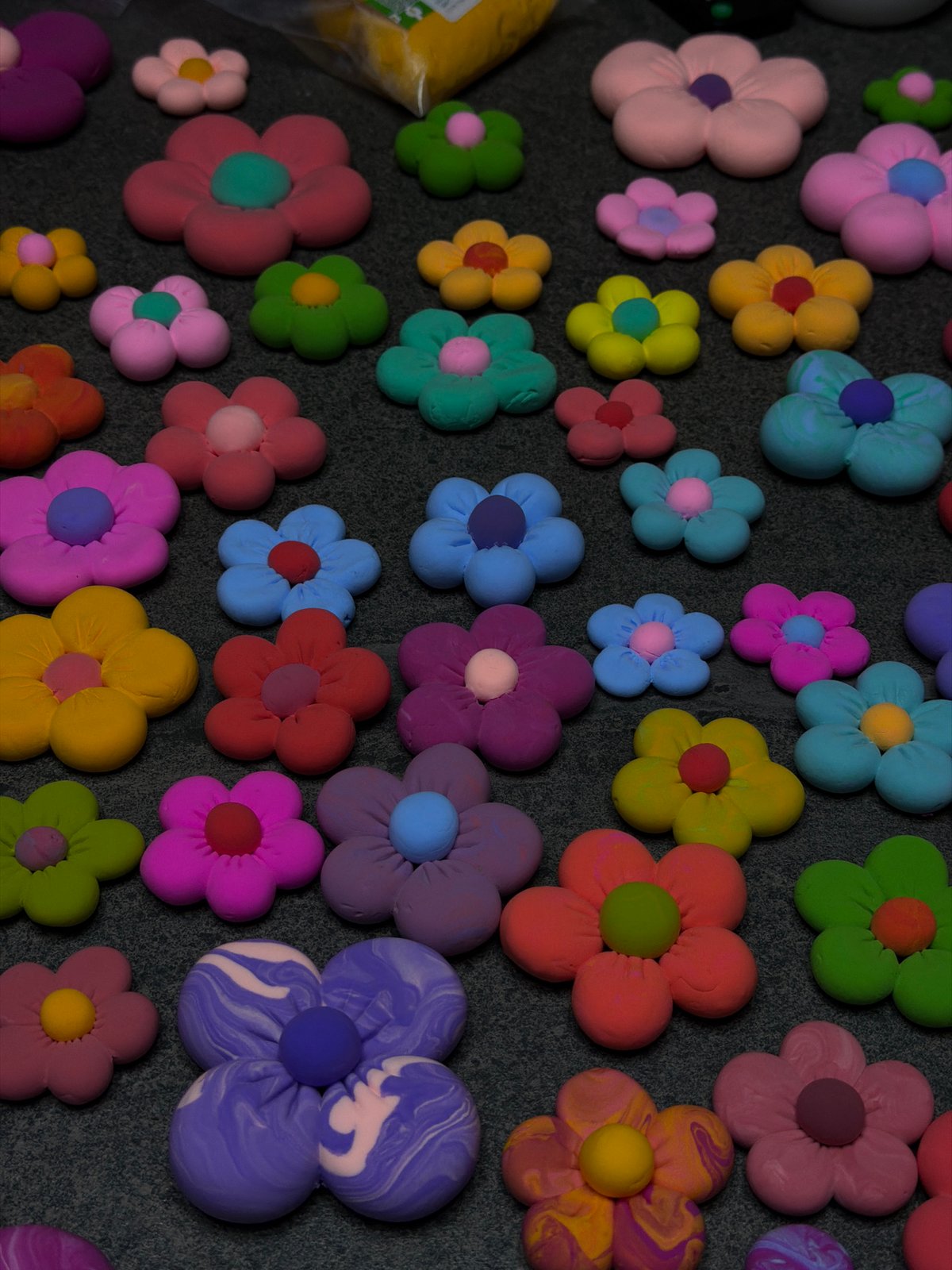 Handmade clay flowers displayed in colorful arrangement in Krasnoyarsk