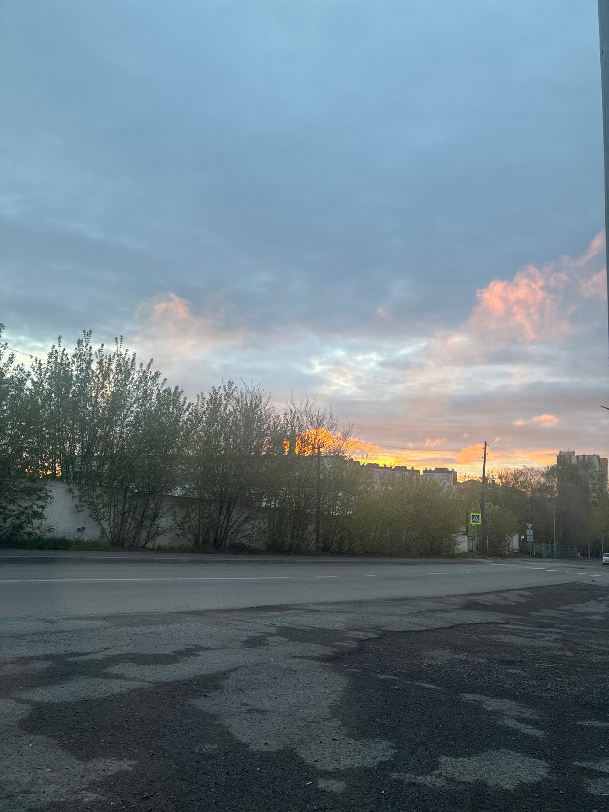 Urban sunset documented across city streets during evening hours