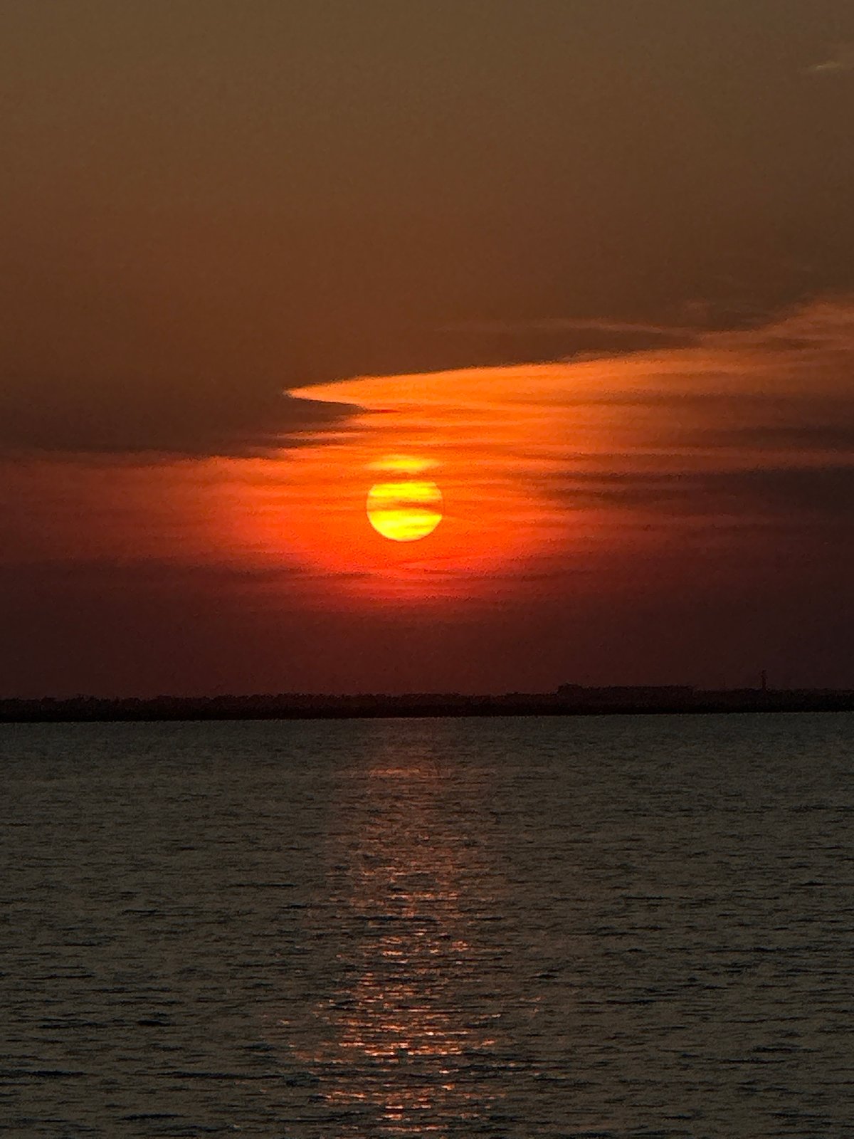 Golden sunset reflects across a Kokshetau lakeside