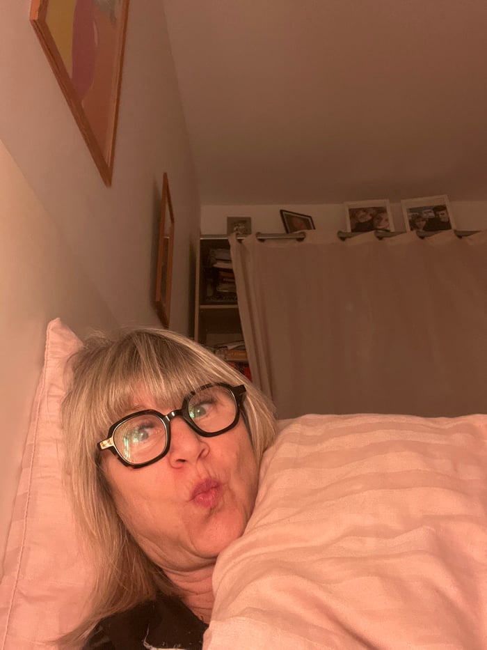 Woman documents intimate evening bedtime routine in French bedroom