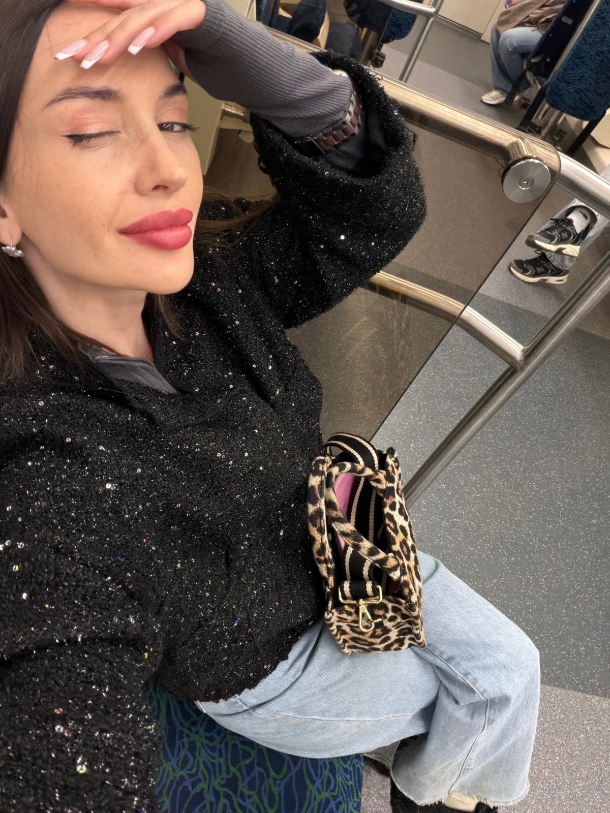 Woman rests on subway seat in Saint Petersburg