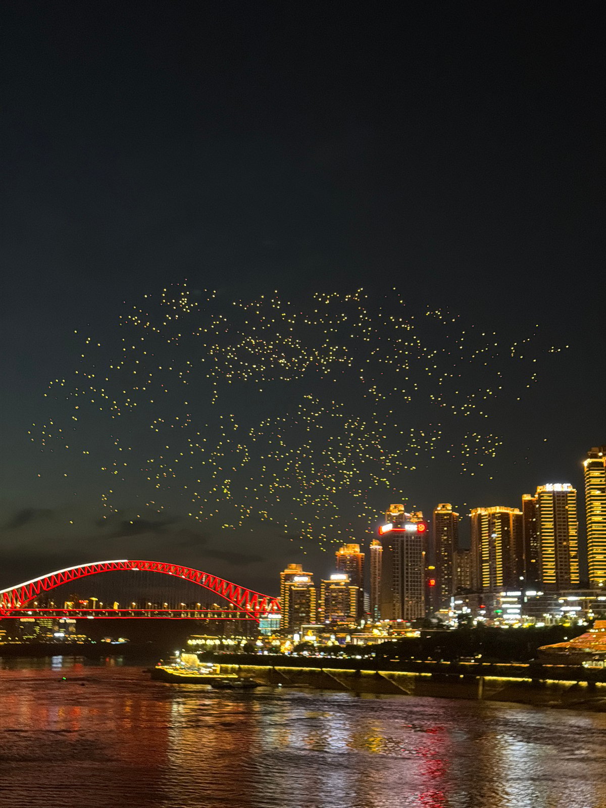 Drone light show over Chongqing's Yangtze River waterfront at night