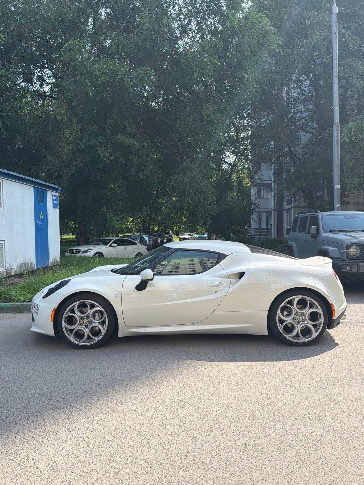 White Alfa Romeo 4C parked on a Moscow street
