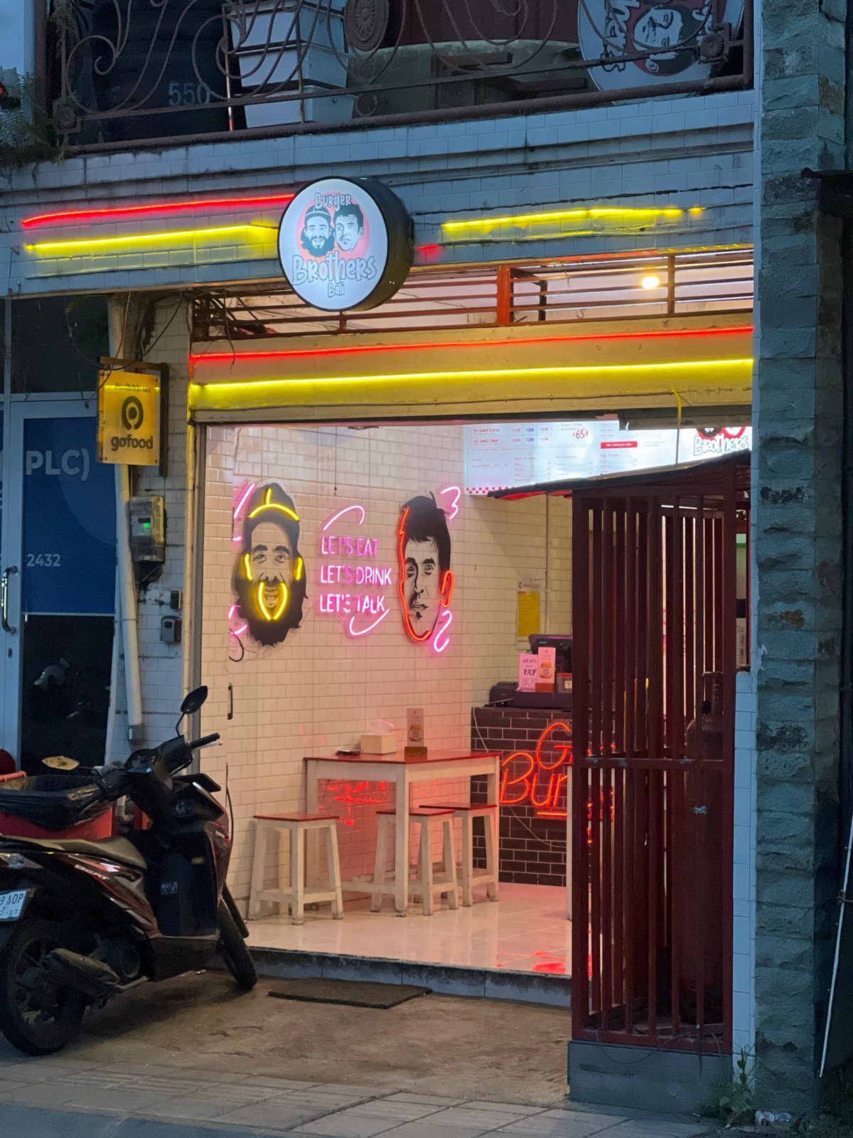 Street art and restaurant signage documented in Tibubeneng, Indonesia